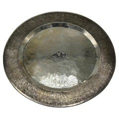 Decorative silver metal plate by Jean Despres