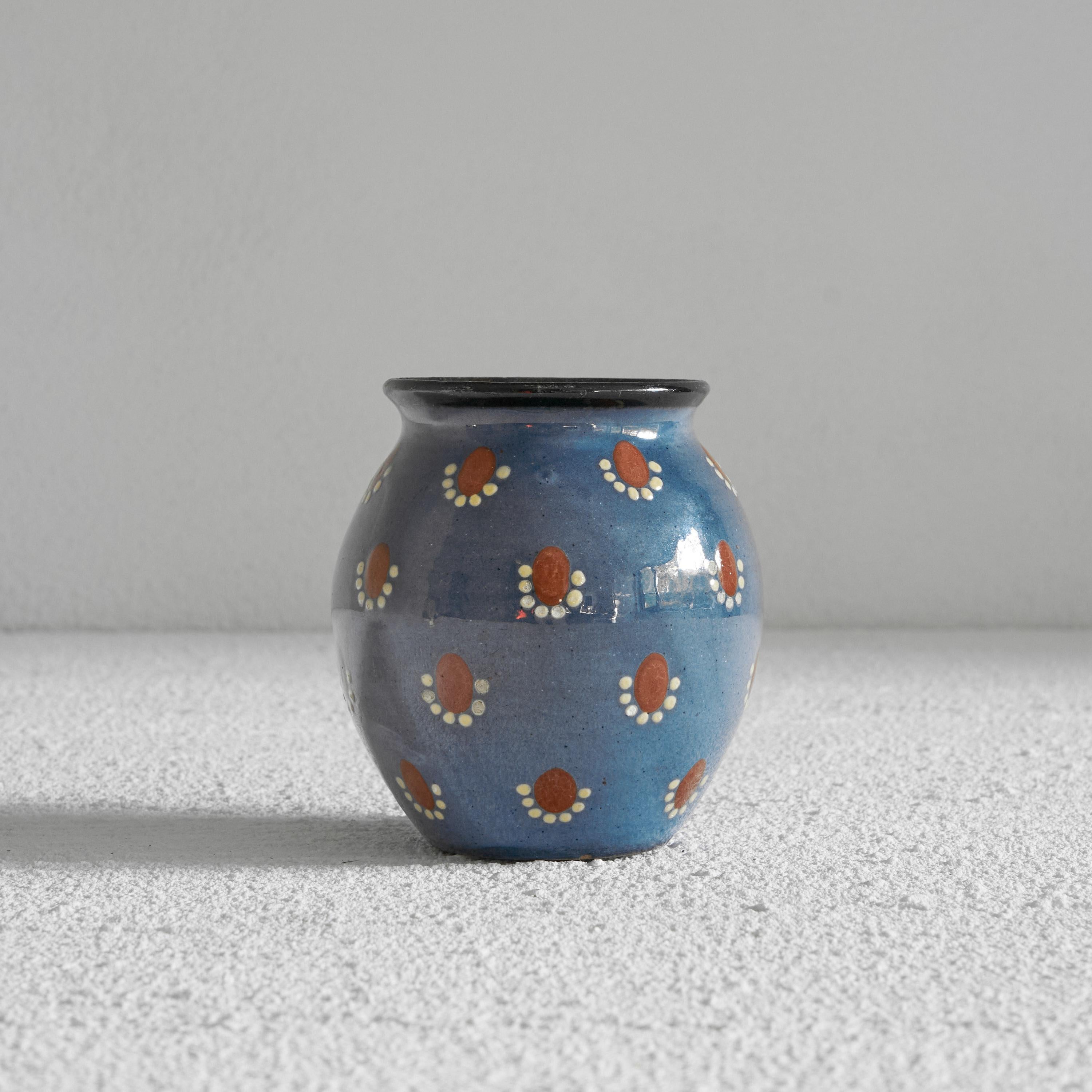 Decorative small studio pottery vase in blue and red. Mid-20th century.

Very fun and decorative small studio pottery vase in blue with red and white decor. Small, but rich in color and appearance, this vase will lift up your spirit when you see