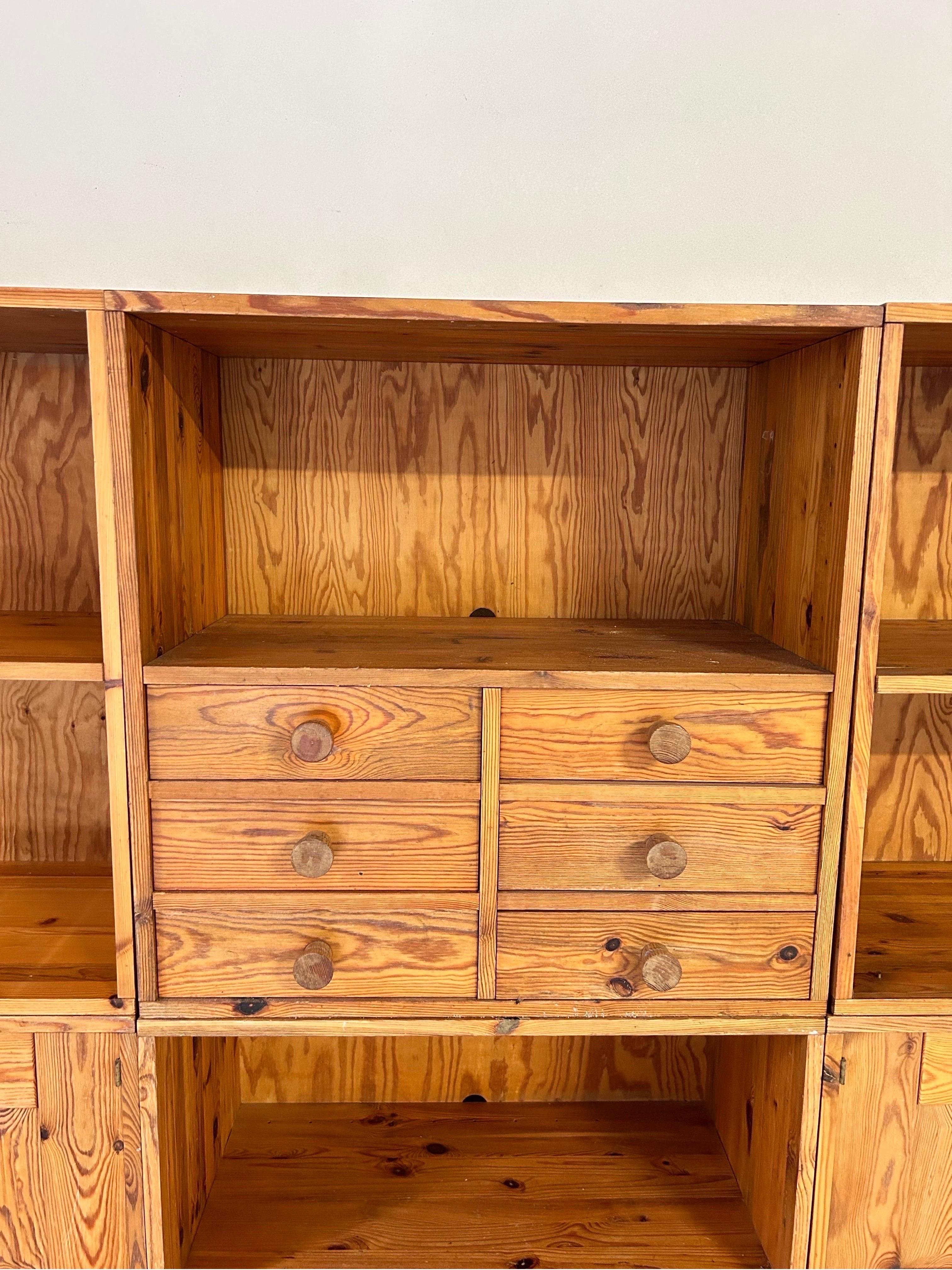 Set of six cabinets by Swedish manufacturer Luxus, crafted and designed in the 1970s. Constructed from solid pine, these cabinets boast a timeless aesthetic, further accentuated by tapered joints adorning the tops. The meticulous craftsmanship and