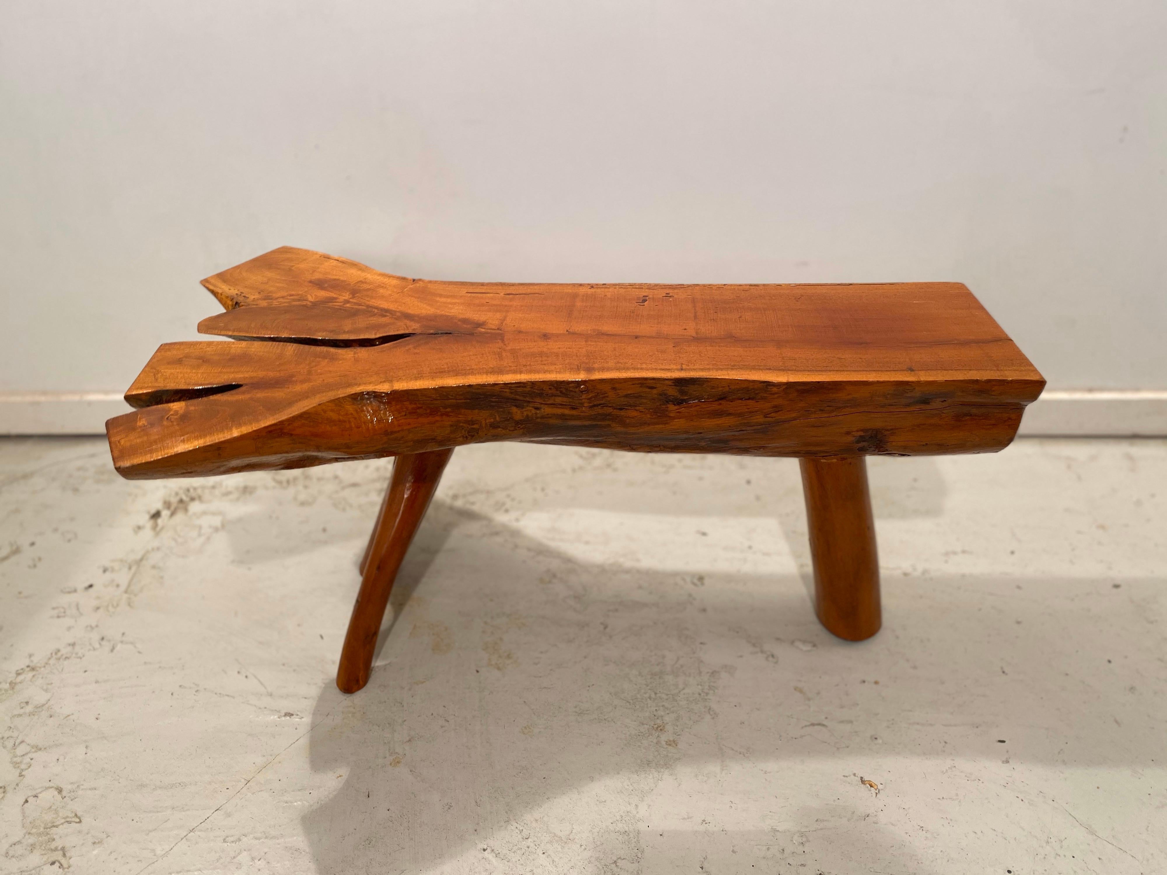 Beautifully hand-crafted plank split log red-oak side table or bench standing on three legs of which one amazing split branch. This is a completely organic piece, no nails at all are used and it is very heavy and sturdy. Also suitable for outdoor