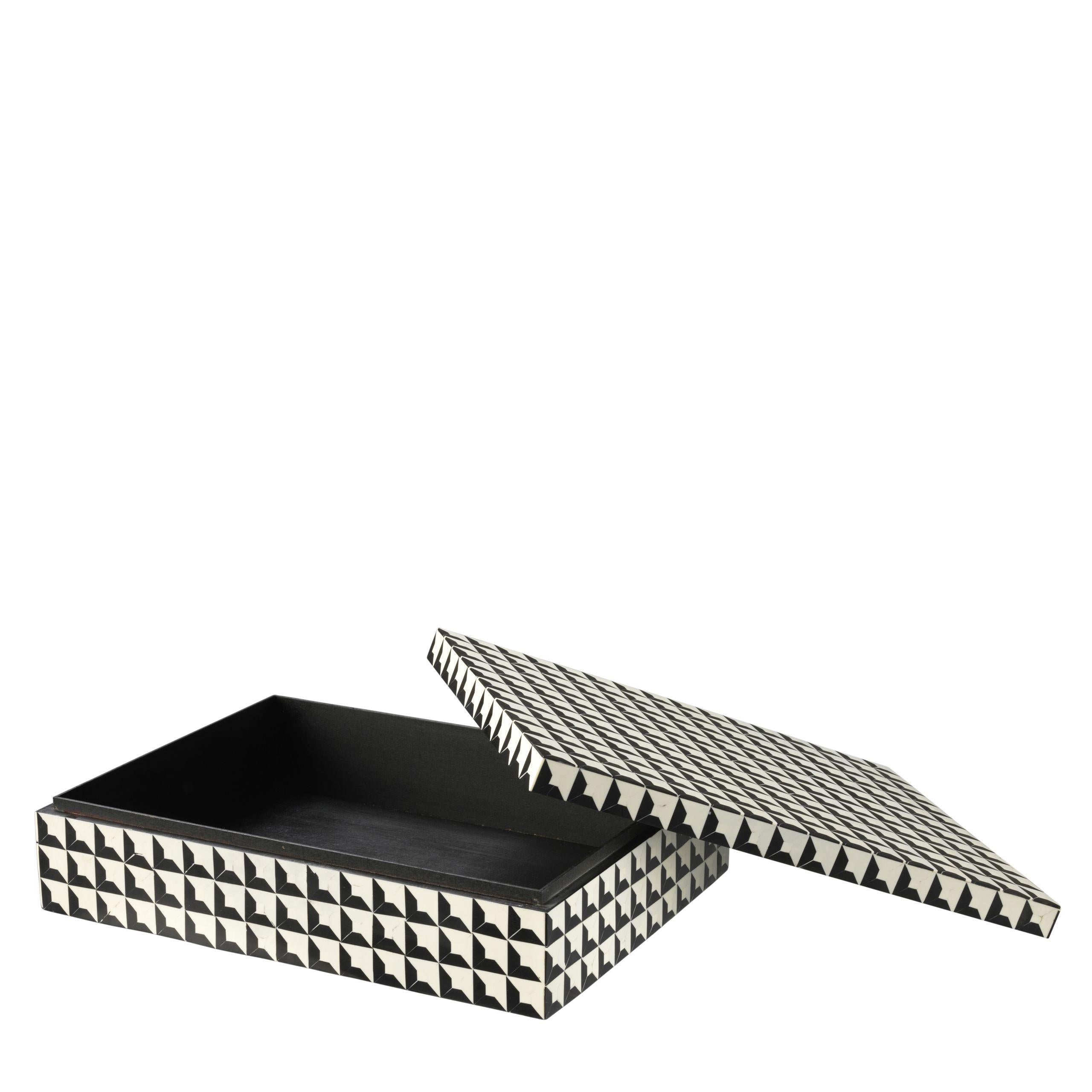 This decorative storage box with a black and white inlay design is sure to pop. At first glance it looks three dimensional but upon closer inspection it’s a flat symmetrical geometric pattern that creates an optical allusion. This fashionable