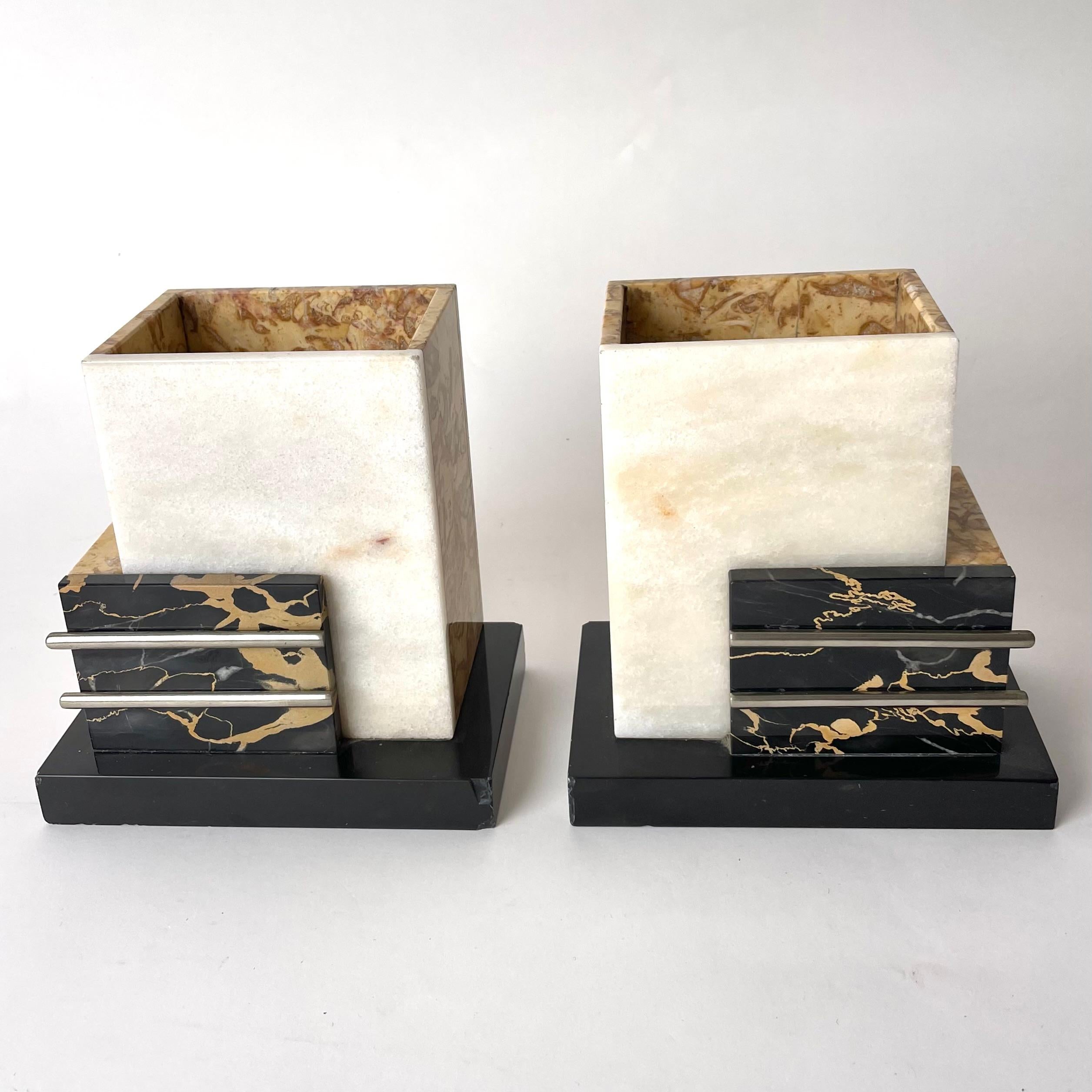 Elegant Decorative Sculptural Pieces usable for storage of e.g. cufflinks or as bookends. 1920s Art Deco, made of Marble and Chrome.

These highly decorative and elegant pieces, in total consisting of four different kinds of exclusive marble, are