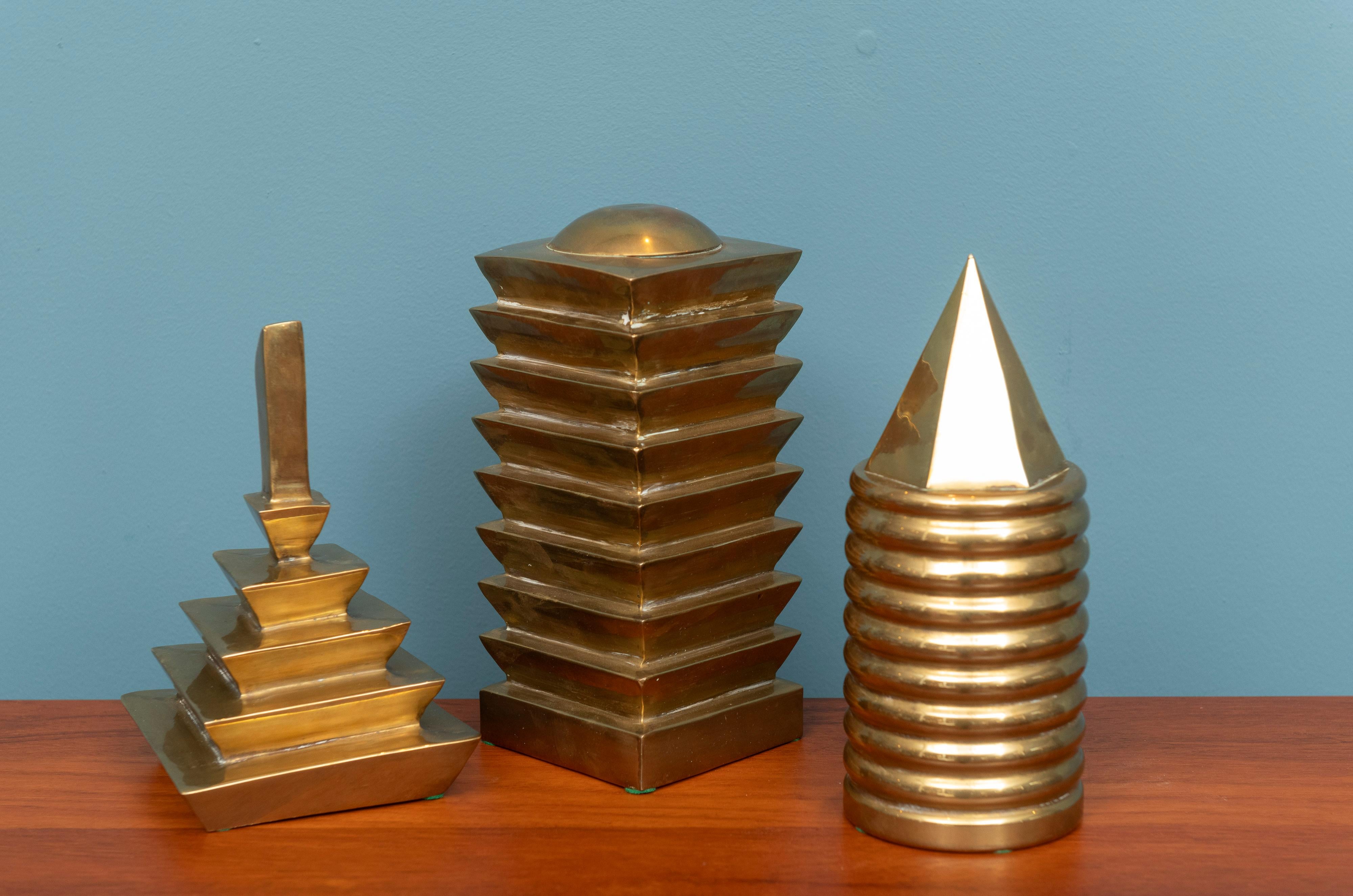 Trio of decorative brass table top objects. Comprising three different solid brass tiered towers, interesting and well made.
