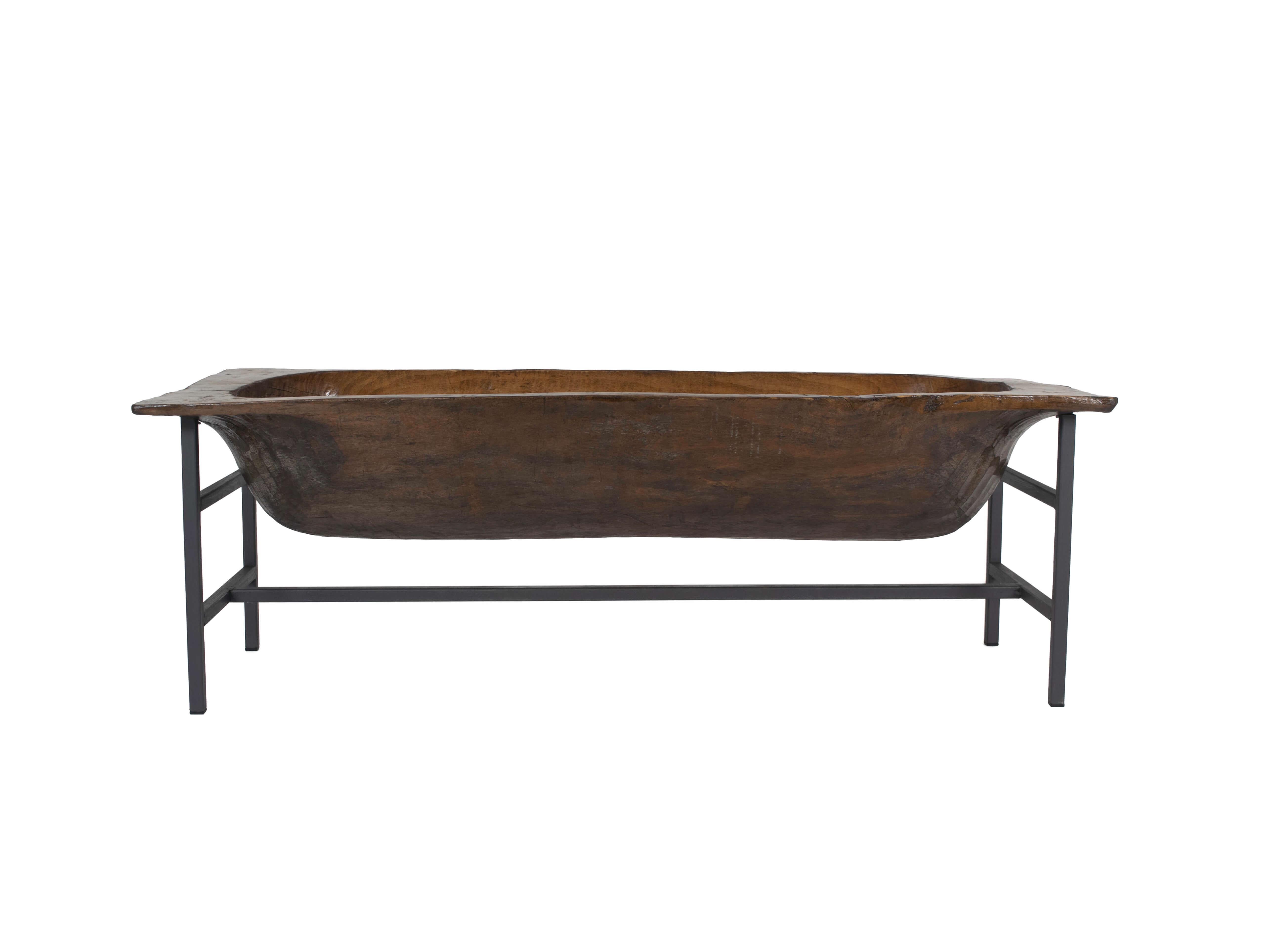 This wooden trough is simply a great decorative object. The combination of the robust and aged wood with the new steel structure makes it very interesting. It can be used as a 'side table or planter or even as a 'magazine rack'. It has a great used