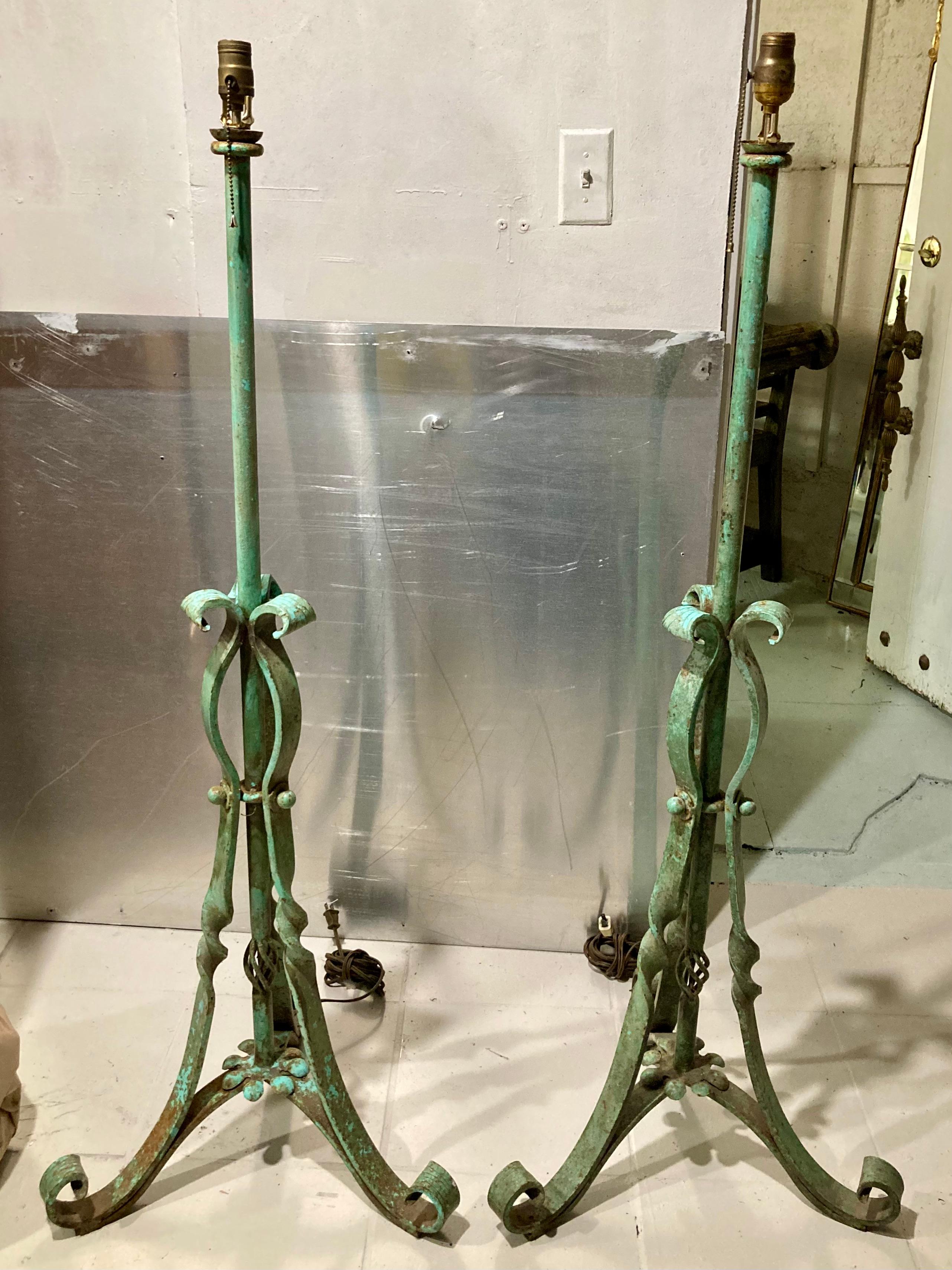 Beautiful pair of decorative verdigris iron floor lamps. The patina is gorgeous and adds to the character. Just add your favorite shade style.