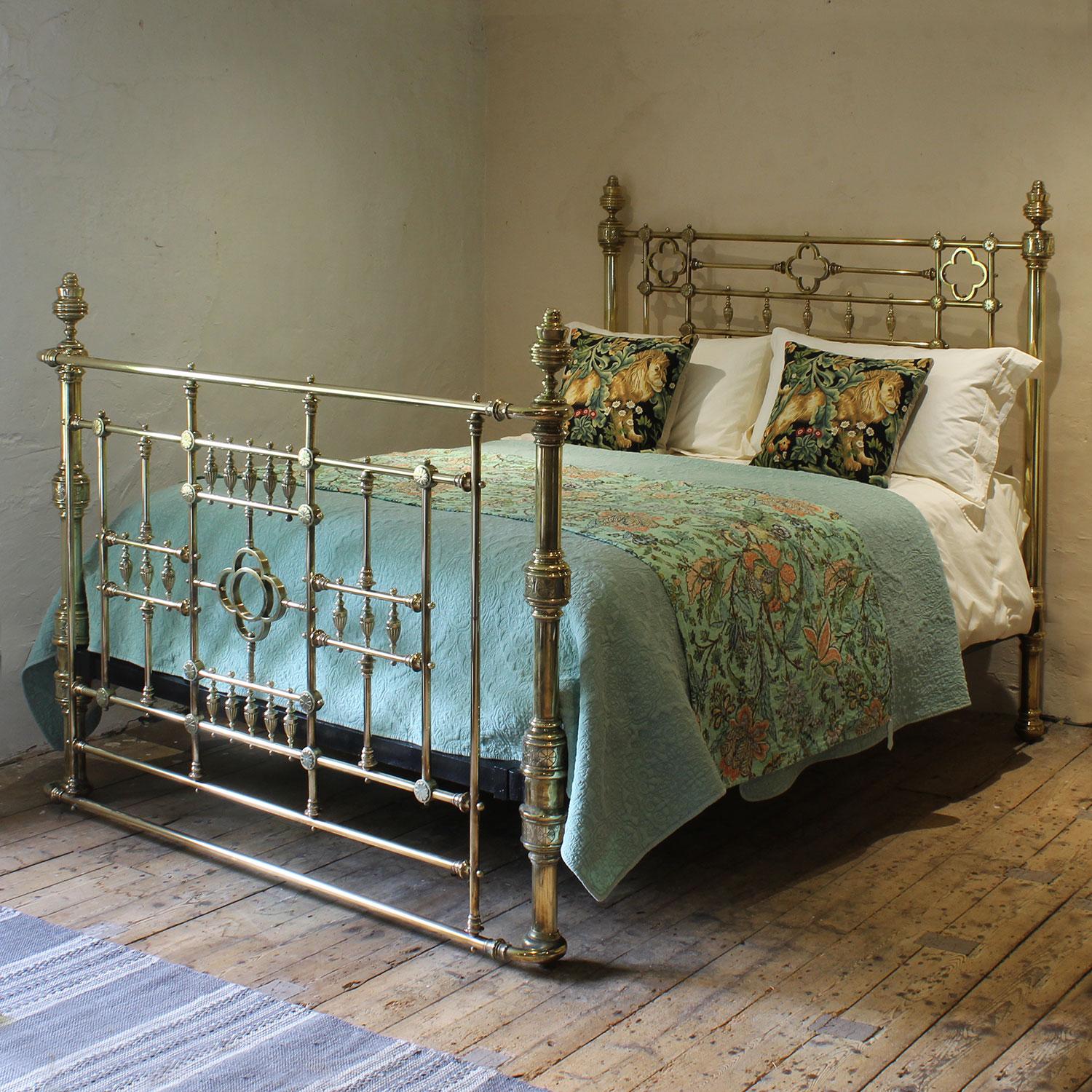 A magnificent top quality all brass Victorian antique bed with bow foot and decorative features including urns and clover rings.
This bed has the original patina of 150 years, but we can repolish and lacquer if required. Please ask for a