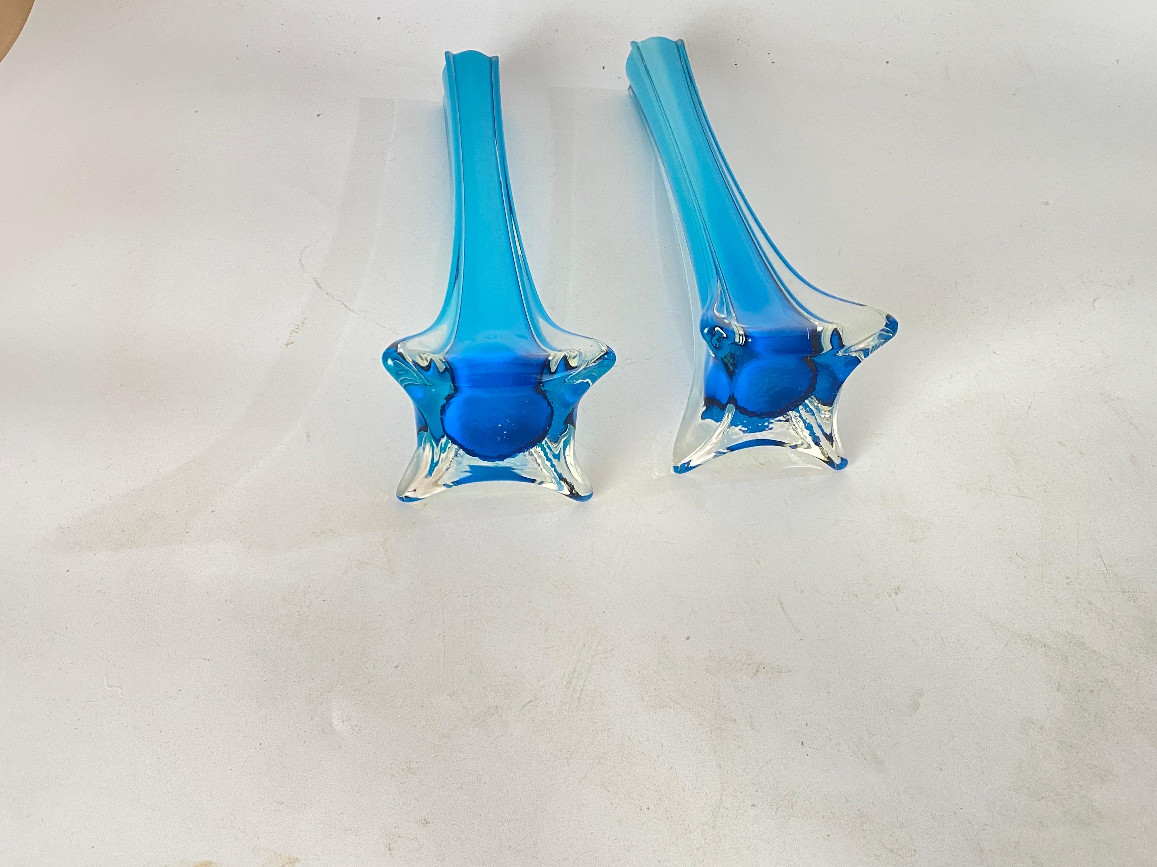 This glass decorative vases, has been made in France circa 1960. in a blue color.
They are soliflore Vases.