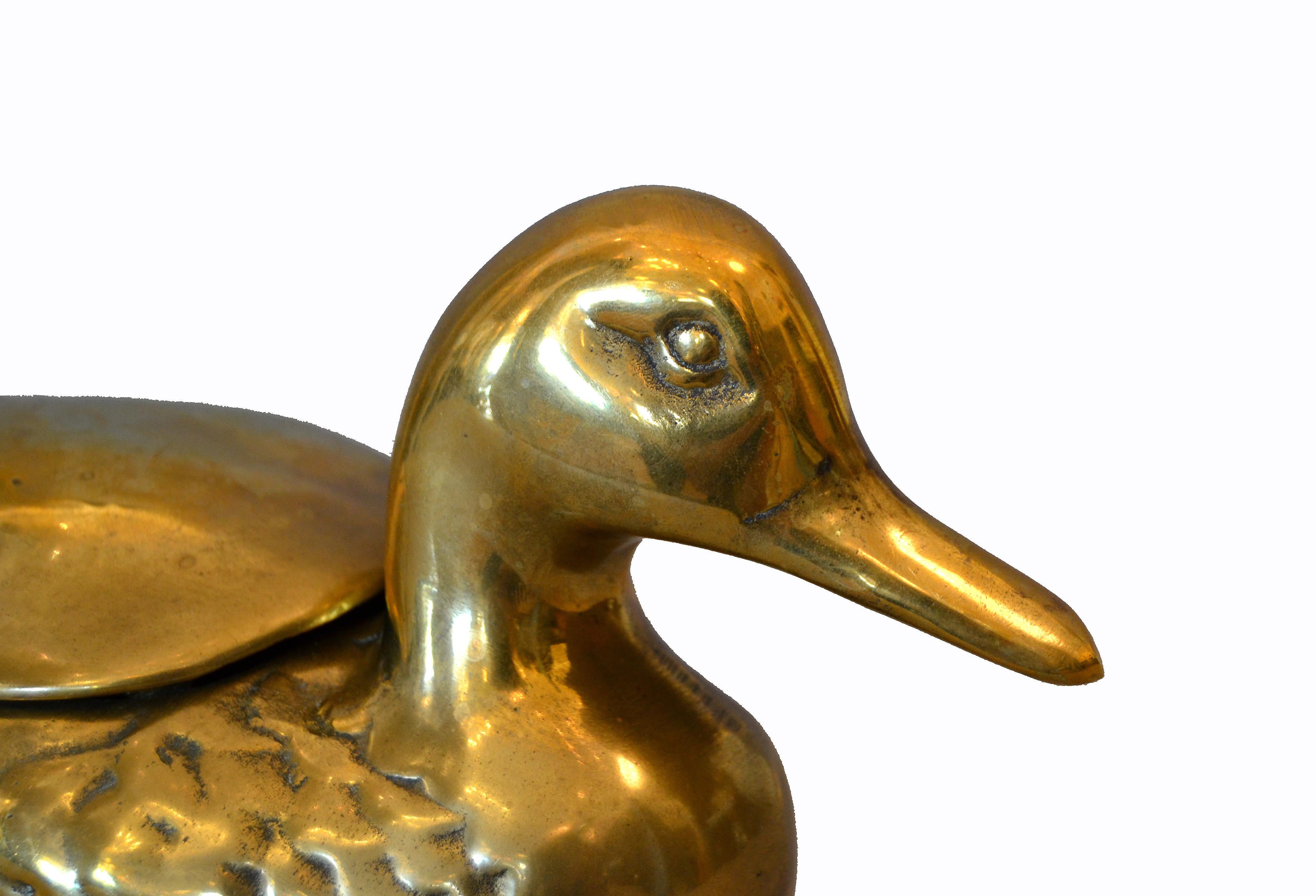 Mid-Century Modern decorative vintage lidded cast brass duck box, jewelry box, desk accessory.
No markings.
  