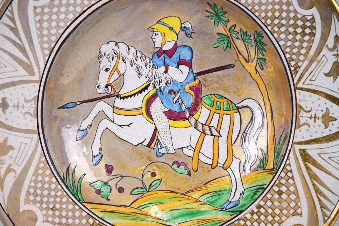 This vintage plate is an original decorative ceramic object realized in Italy during the 20th century by Molaroni Pesaro manufacture, Italy.

This very rare and colored ceramic plate is decorated with a knight on horseback.

The plate was