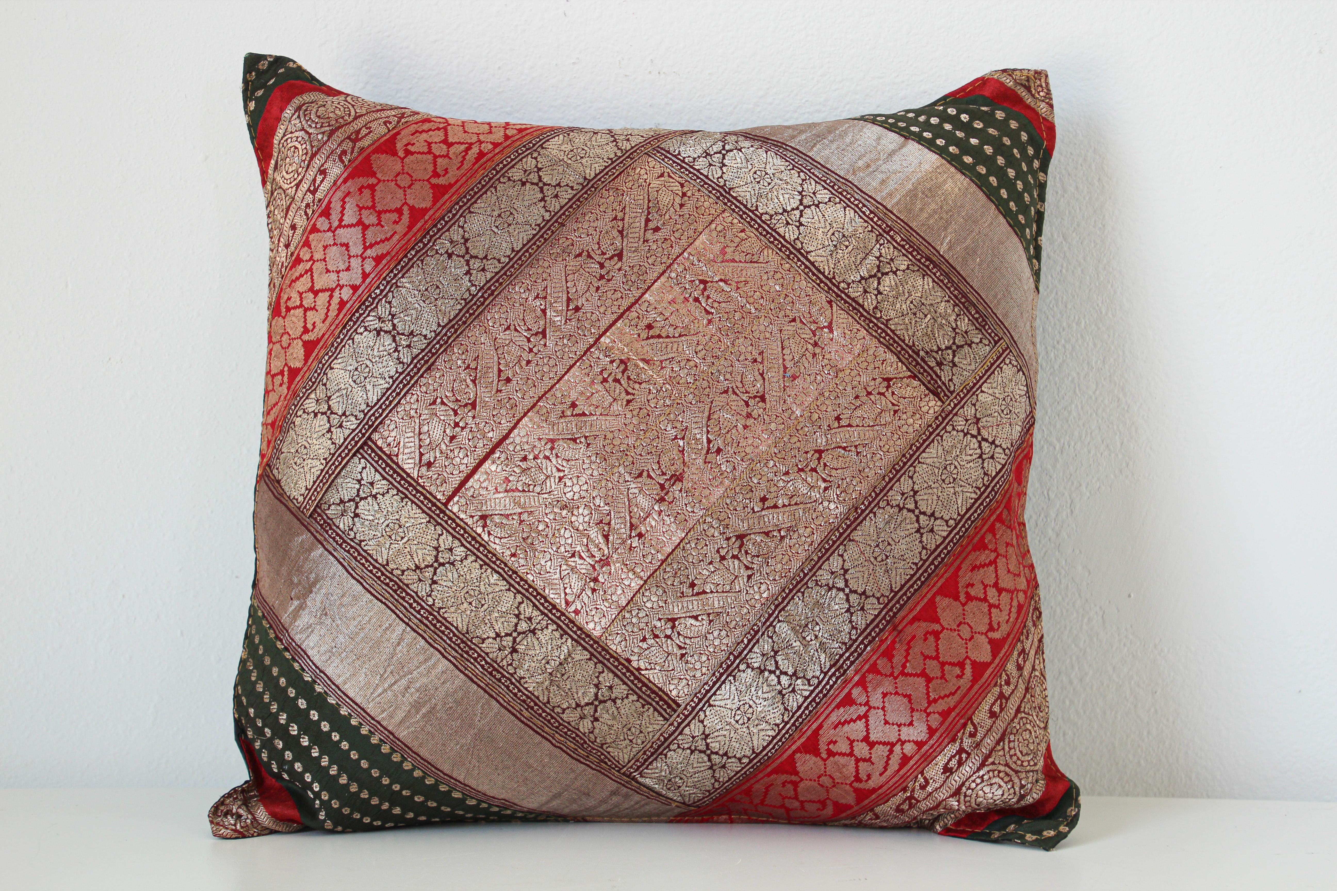 Description
Decorative accent silk throw pillow made from vintage sari borders.
One of a kind silk sari, red, green, gold, green, purple, metallic threads sari borders.
Handcrafted in India.
We do have multiple in this style, but each one is