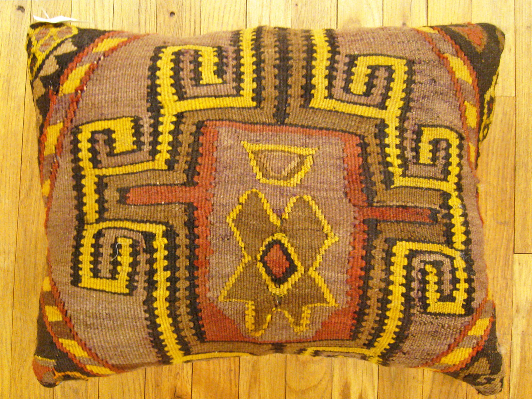 Vintage Turkish Kilim rug pillow; size 22” x 18”.

A vintage decorative pillow with geometric abstracts allover a brown central field, size 22” x 18”. This lovely decorative pillow features a vintage fabric of a KIilim carpet on front which is