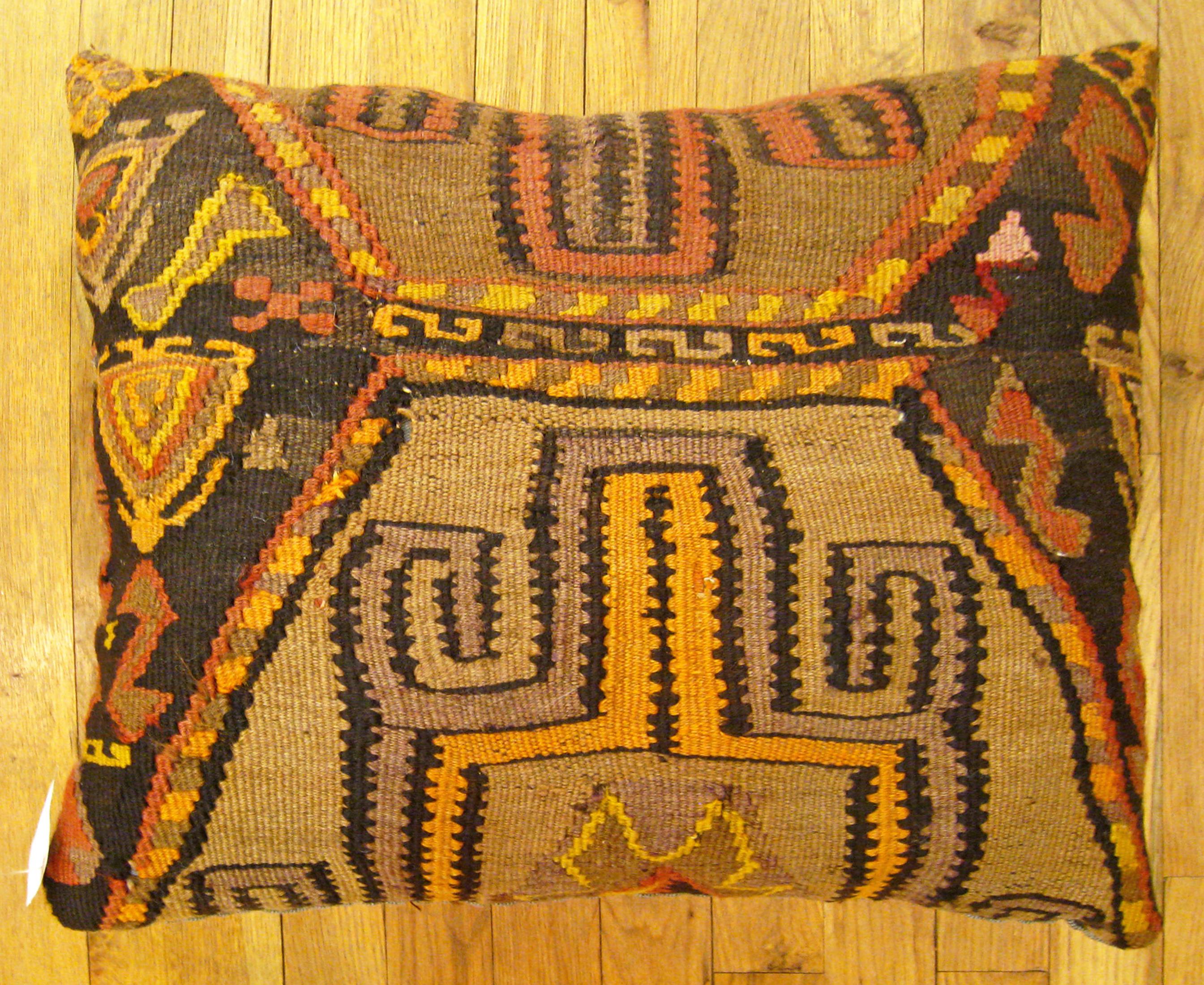 Vintage Turkish Kilim Rug Pillow; size 22” x 18”.

A vintage decorative pillow with geometric abstracts allover a brown central field, size 22” x 18”. This lovely decorative pillow features a vintage fabric of a KIilim carpet on front which is