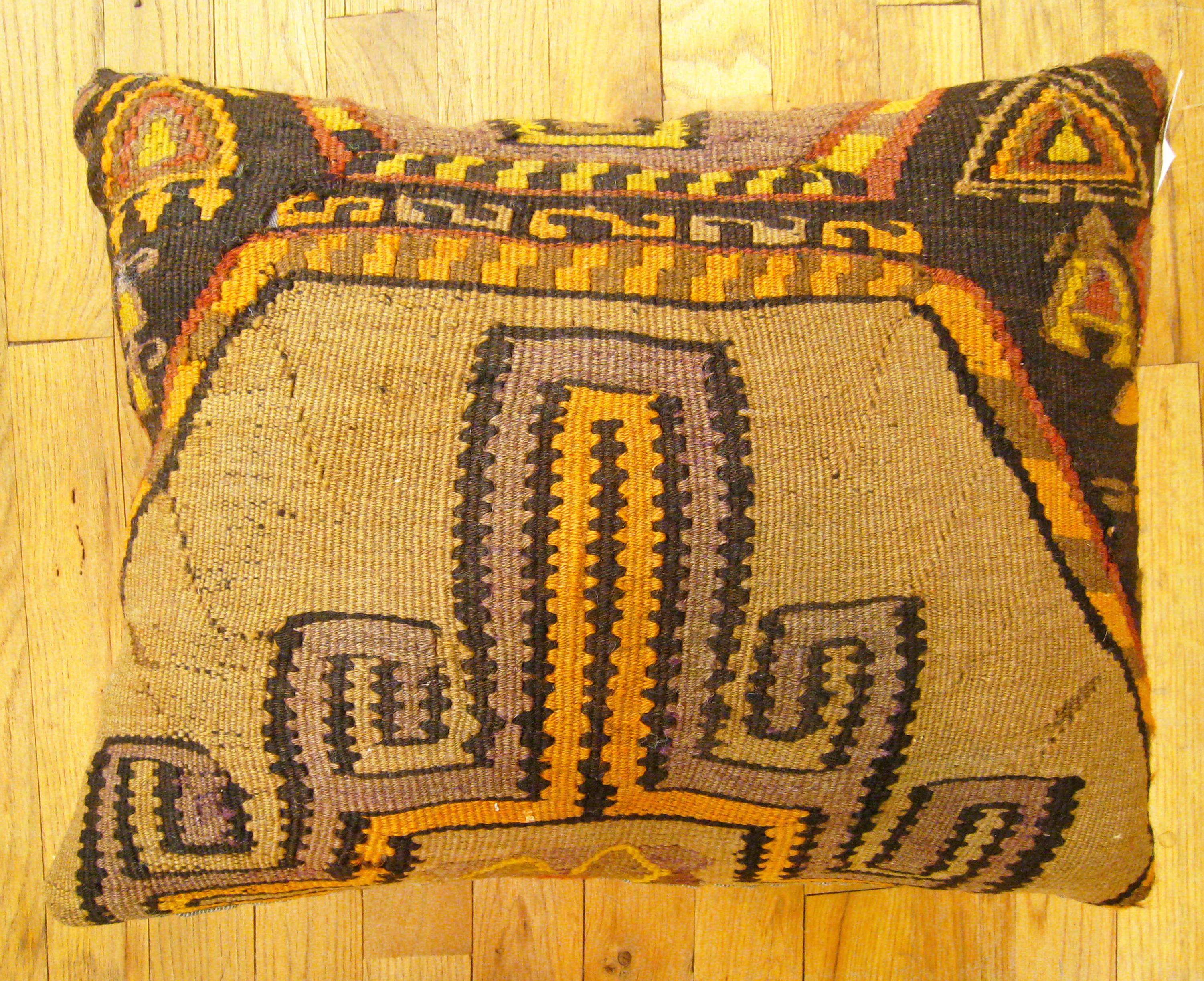 Vintage Turkish Kilim Rug Pillow; size 22” x 18”.

A vintage decorative pillow with geometric abstracts allover a brown central field, size 22” x 18”. This lovely decorative pillow features a vintage fabric of a KIilim carpet on front which is