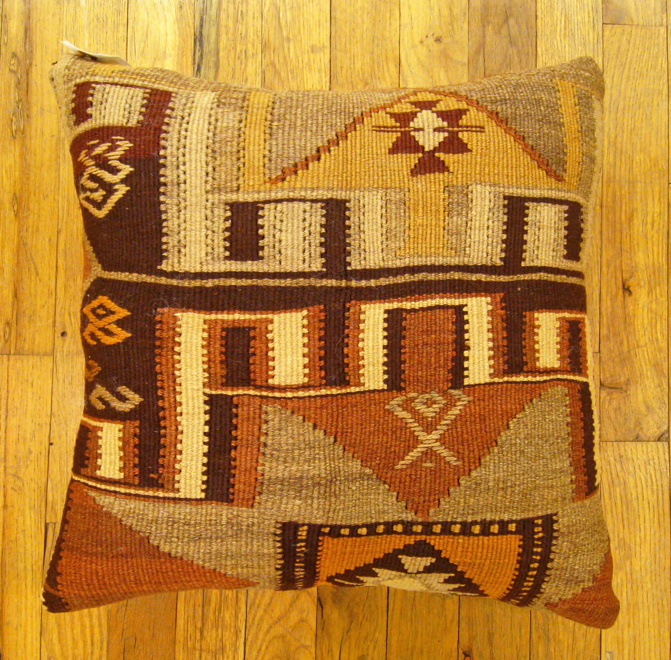 Vintage Turkish Kilim Rug Pillow; size 17” x 18”.

A vintage decorative pillow with geometric abstracts allover a brown central field, size 17” x 18”. This lovely decorative pillow features a vintage fabric of a KIilim carpet on front which is