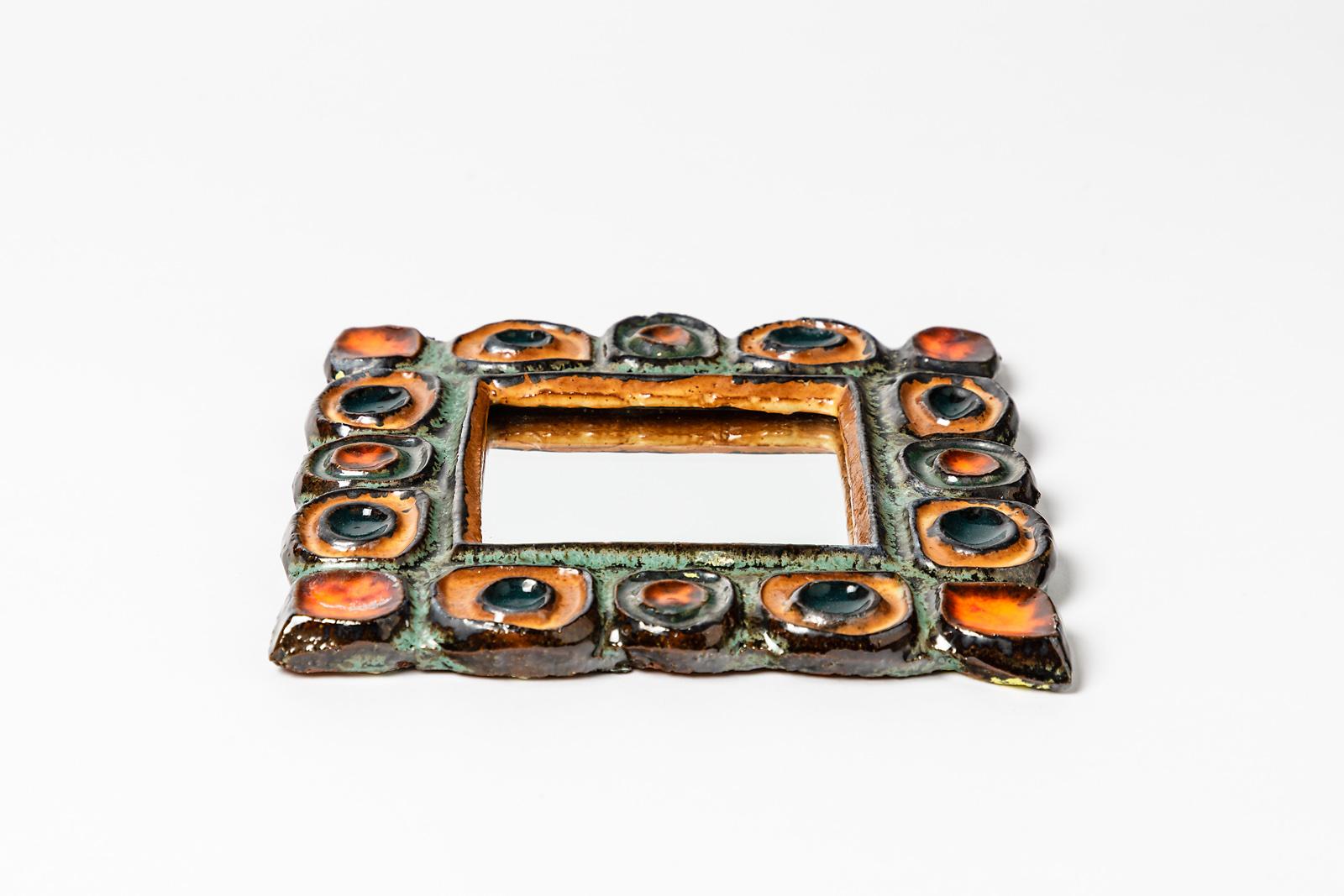 Les Argonautes

Elegant and decorative ceramic wall mirror by French artist

circa 1960, midcentury French design

Orange and green ceramic glazes colors

Original perfect conditions

Measures: Height 2cm, large 16cm.
 