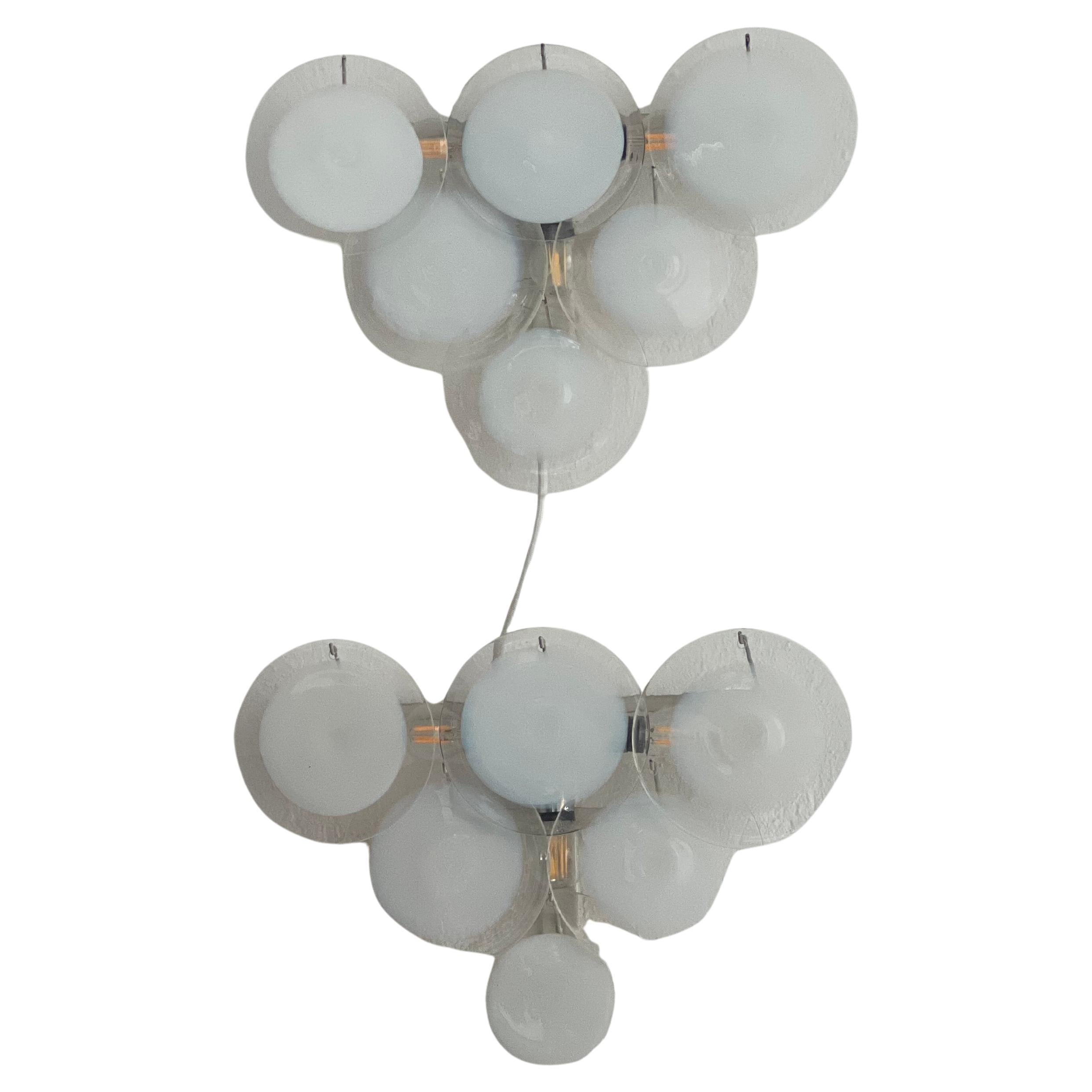 Vintage Vistosi Applique - Murano Lights - Mid Century Decorative Lamps

Offered here is a very rare, attractive and extremely well preserved set of two wall sconces in Murano glass, by famed Italian designer Gino Vistosi. The three pieces all show