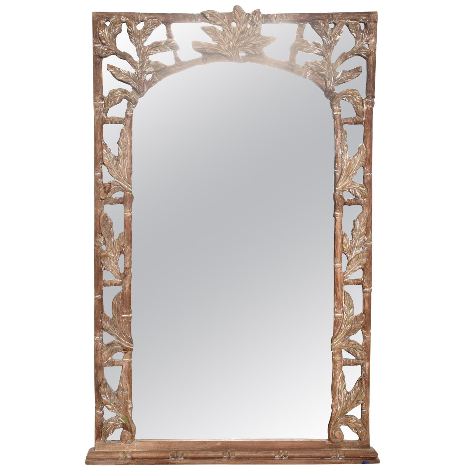 a decorative rectangle wall mirror in an original hand-carved wood frame.
leaf ornamentation with Faux Bamboo border.
Unmarked. In the style of Tommy Bahama.
46.5H x 28.5 W x 2 D.
Preowned Original vintage good unrestored condition.
Refer to