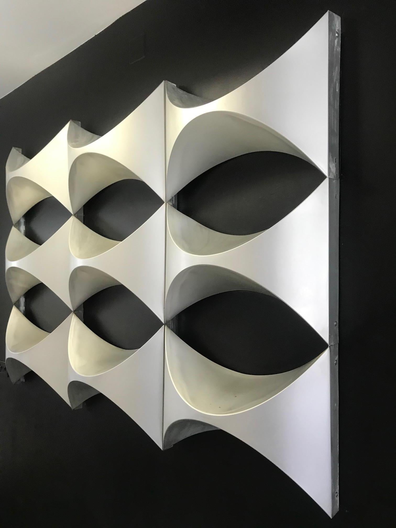 Decorative wall panel, element of French architecture, 1970. This panel is made up of 9 polished aluminum modules. They come from a building facade.

The study center egg was created in 1962, passage Du Guesclin in Paris. It is a multidisciplinary