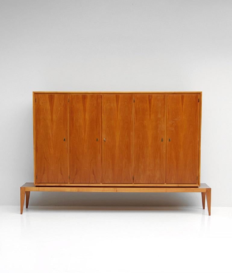 Decorative and stunning walnut cabinet with ant shaped legs. 
The upper cabinet is removable. The cabinet was made in the 1950s and has brass keys.
 