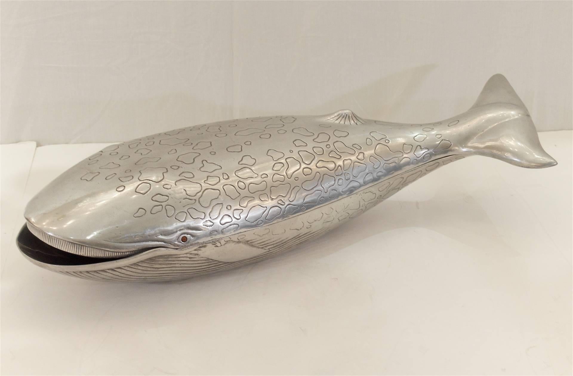 Unusual decorative aluminium centrepiece in the form of a whale, with ruby-toned eyes. Lid comes off for storage or display.