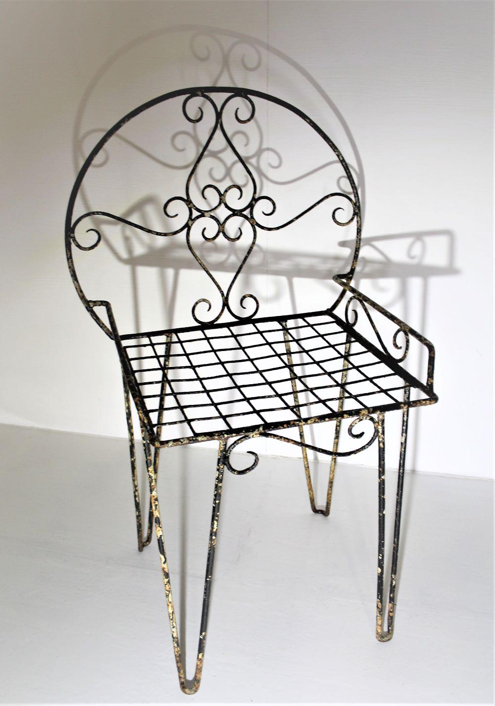 A beautifully simple scroll metalwork chair with just the most perfect, as found, patina.
Nice scroll detailing, a lovely decorative piece.
A light coat of wax has been applied to the surface to preserve the perfect wear and patina.