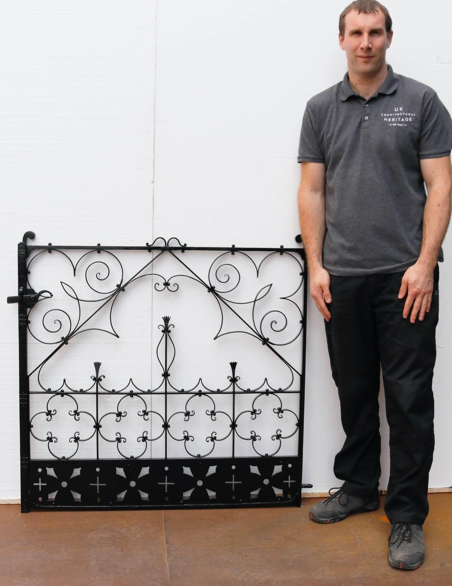 With its elegant, handcrafted scrollwork and ornate details, this antique wrought iron gate is a beautiful addition a traditional garden. It has stood the test of time for more than 130 years, made by a talented 19th century blacksmith. It has a