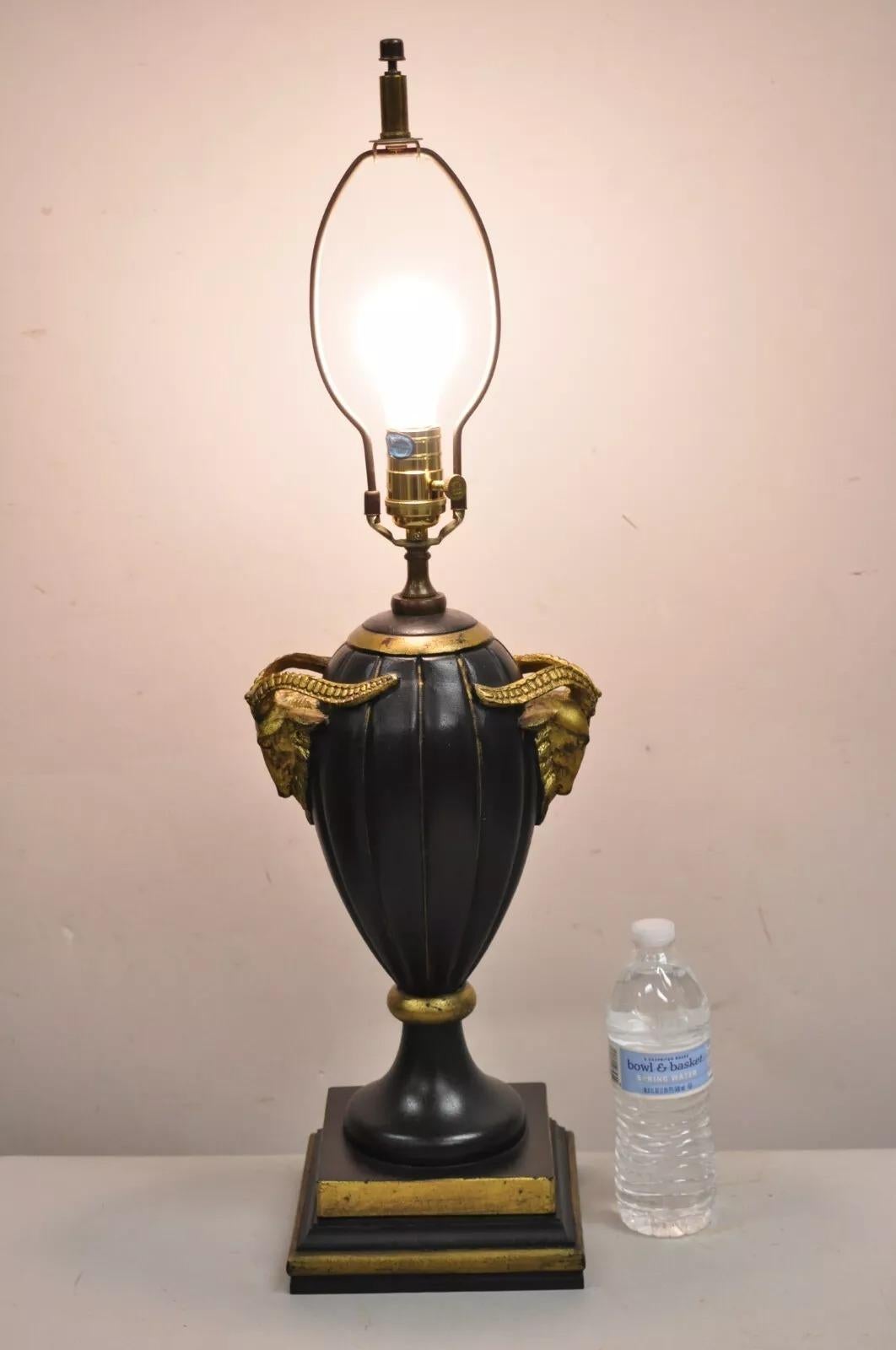 Decorator Chelsea House Neoclassical Style Black & Gold Cast Fiberglass Table Lamp w/ Rams. Circa Late 20th Century. Measurements: 30