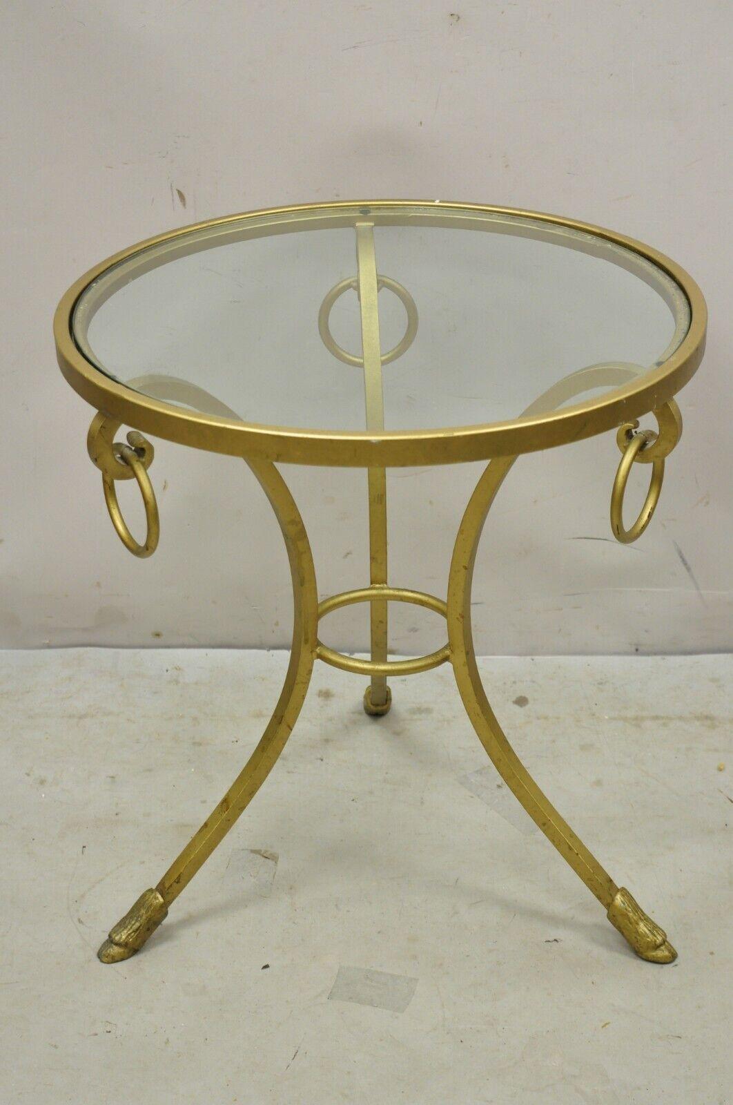 Decorator Gold Italian Neoclassical Style Hoof Foot Round Occasional Side Table Item features an Inset round glass top, tripod base with hoof feet, drop ring accents, gold painted finish, great style and form. Circa Late 20th Century. Measurements: