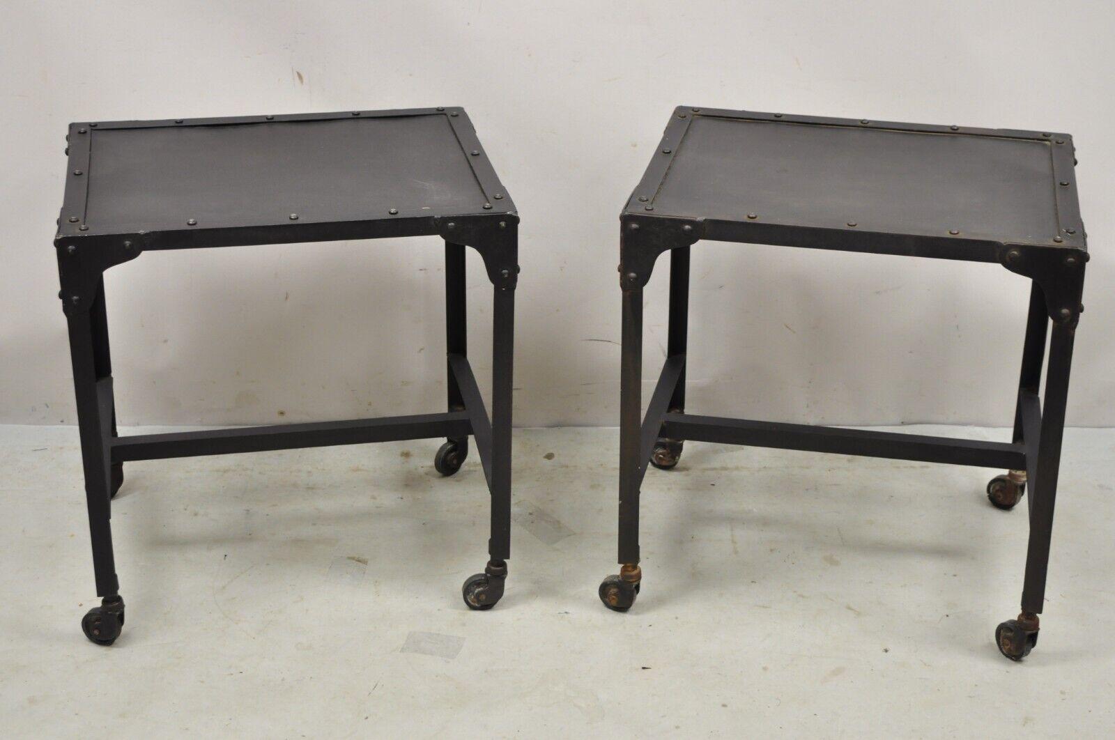 Decorator Industrial Vintage Style Steel Metal Side Tables on Wheels - a Pair. Item features rolling casters, steel metal frames, stretcher base, riveted construction, very nice set, great style and form. 
circa late 20th - early 21st century.