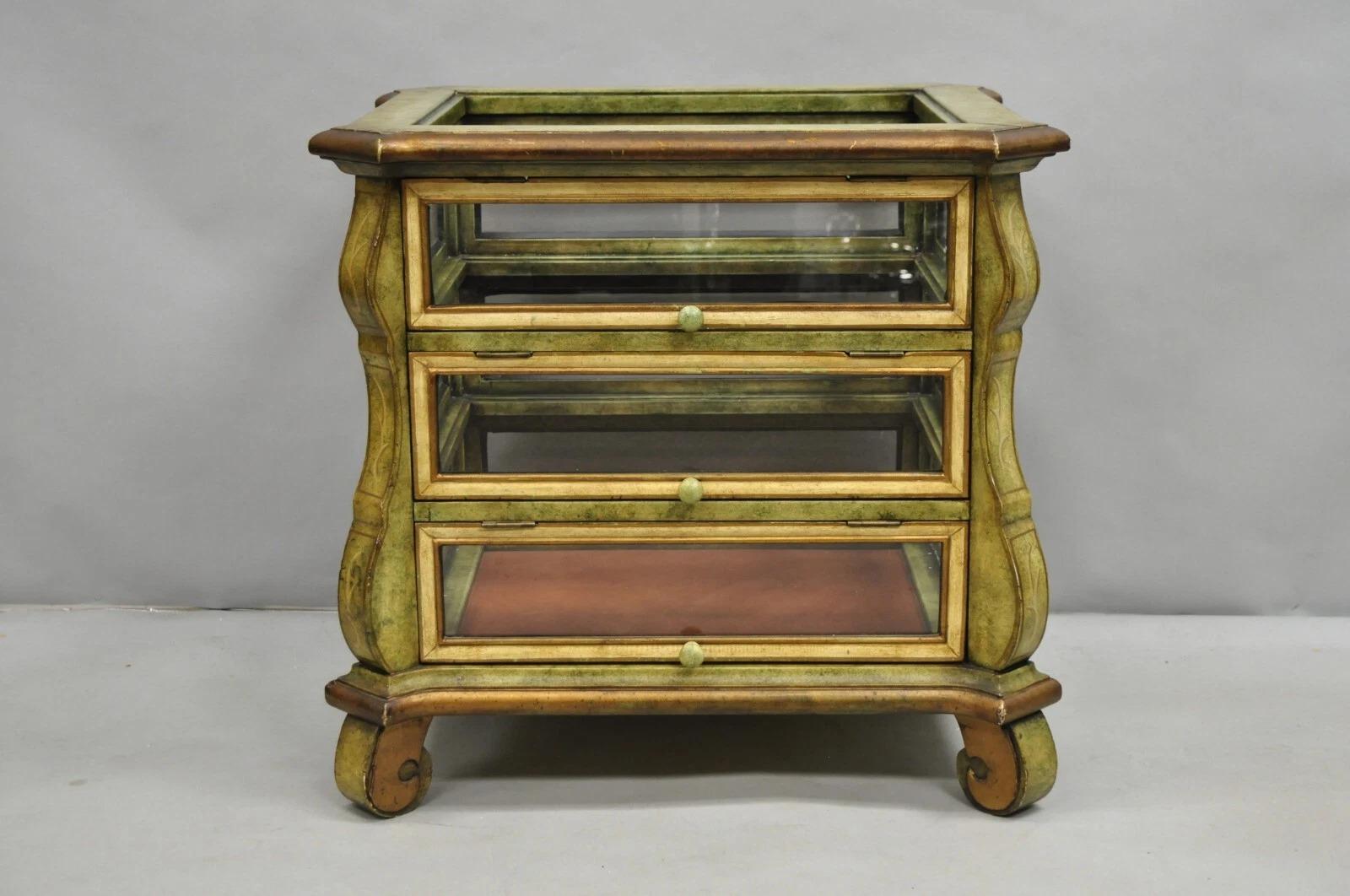 Decorator Italian Mediterranean Green Distress Painted 3 Tier Glass Curio Side Table. Item features 3 front doors and glass on all sides. Top glass is missing as well as the interior glass shelves. Circa Late 20th Century. Measurements: 27