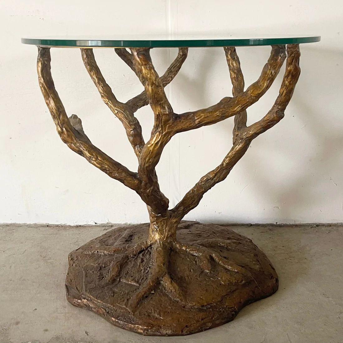 This impressive sculptural tree side table boasts a decorative bronze style composite design and a circular glass top to match. Unique accent table for use as a sofa side table or lamp table- exquisite design makes a memorable addition to any