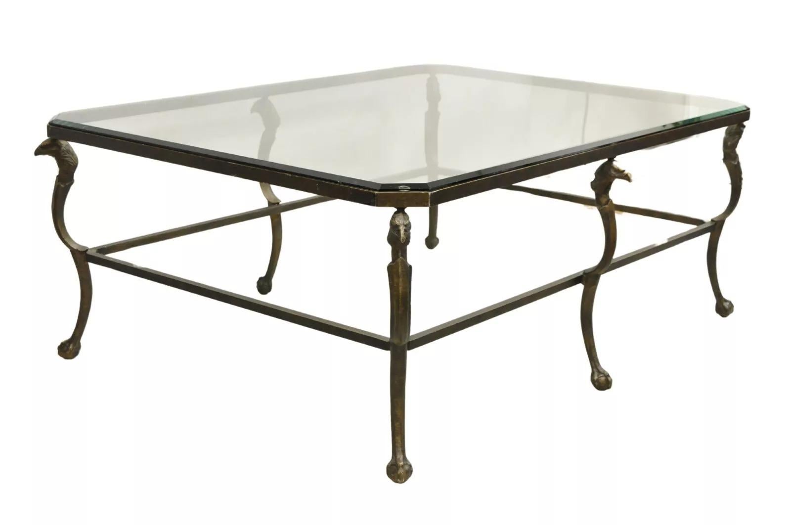 Decorator Regency Style Large Metal & Glass Coffee Table With Eagle Heads, Ball and Claw Feet, and Beveled Glass Top. Circa Late 20th Century. Measurements: 21.5