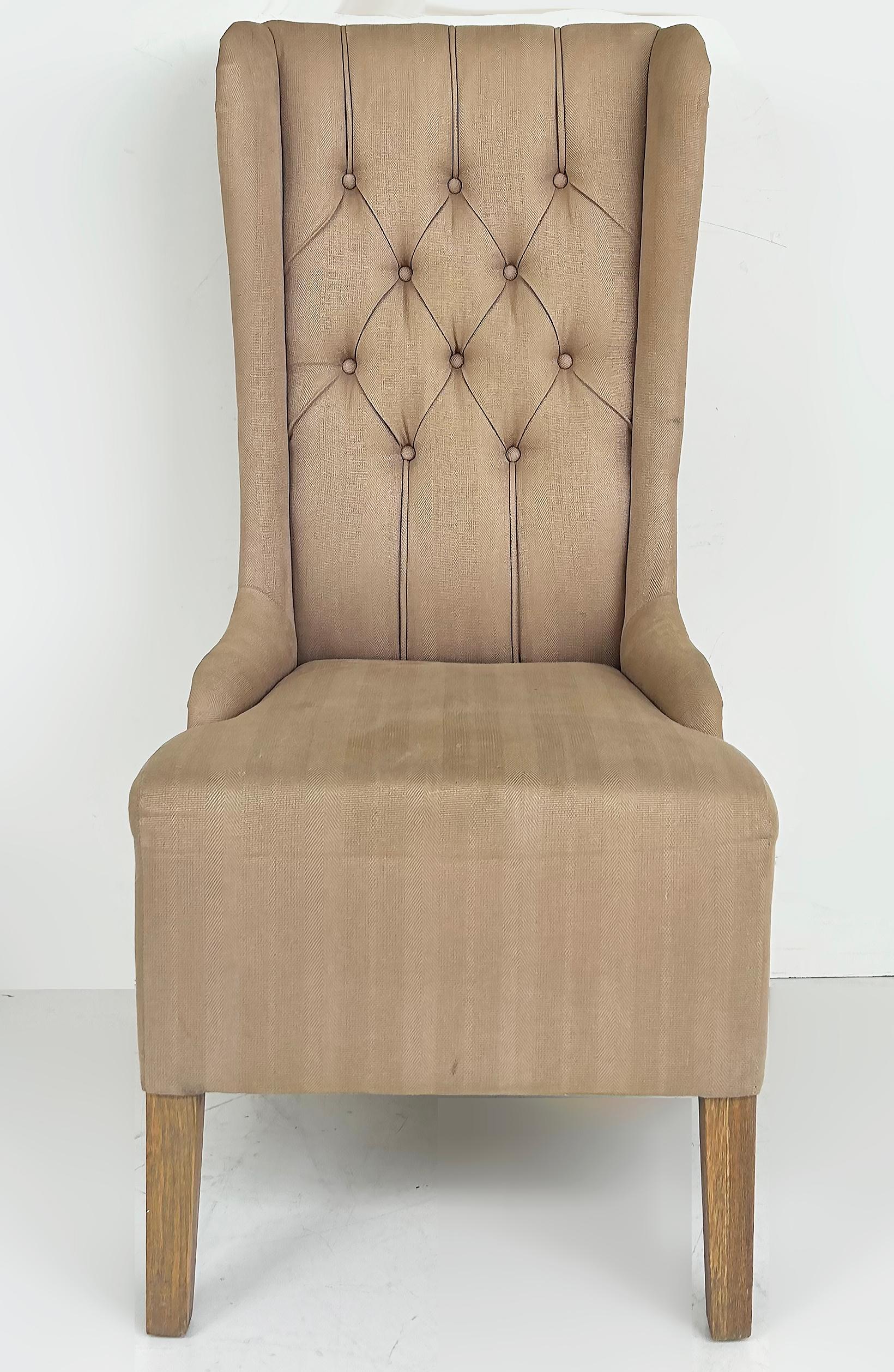 Decorator's Upholstered High Back Tufted Side Chairs to be Reupholstered

Offered for sale is a pair of decorator's tall and slender wingback chairs that will require reupholstering. The chairs have tufted backs and are supported by oak legs. The