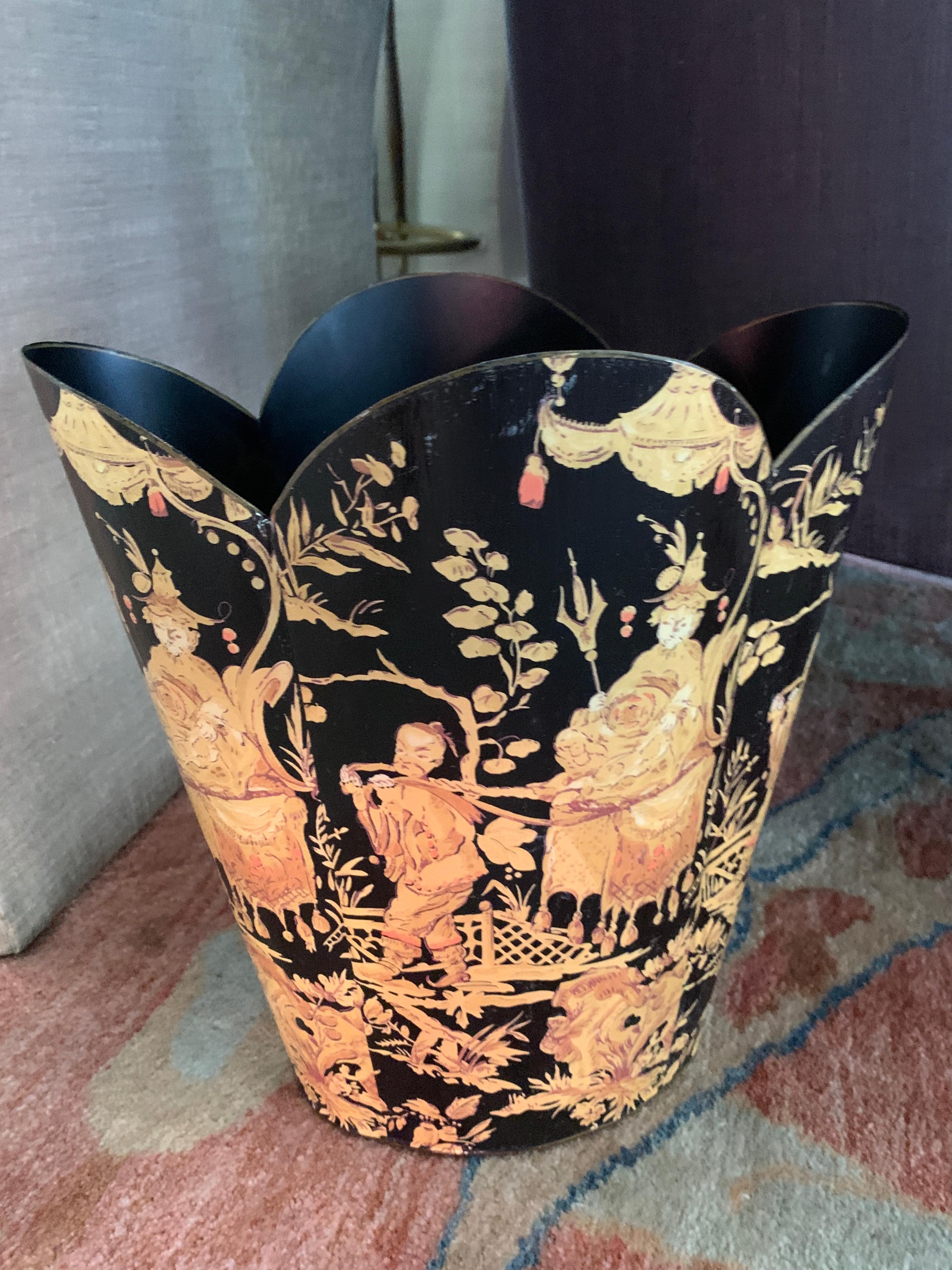 A wonderful Waste or Trash can. The scallop top metal can is covered by decoupage of an asian motif in gold or cream on a black field. A compliment to any room, from the bedroom, bath or office and guest house - a handsome and sophisticated piece.