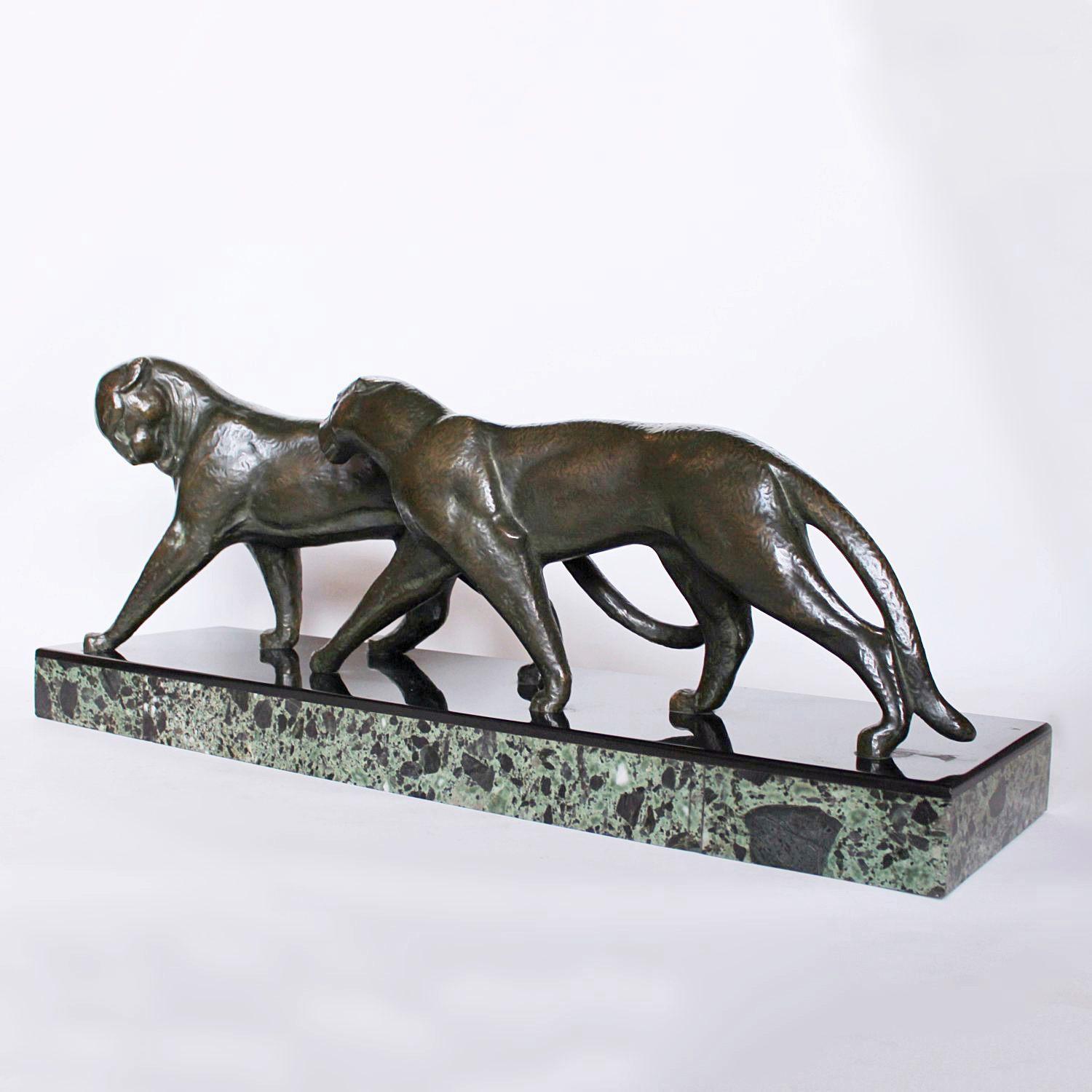 Panthers, an Art Deco, patinated bronze study of a pair of panthers, set over a bi-colored marble plinth. Signed Decoux to marble and to legs.

Artist: Michel Decoux (1837-1924)

