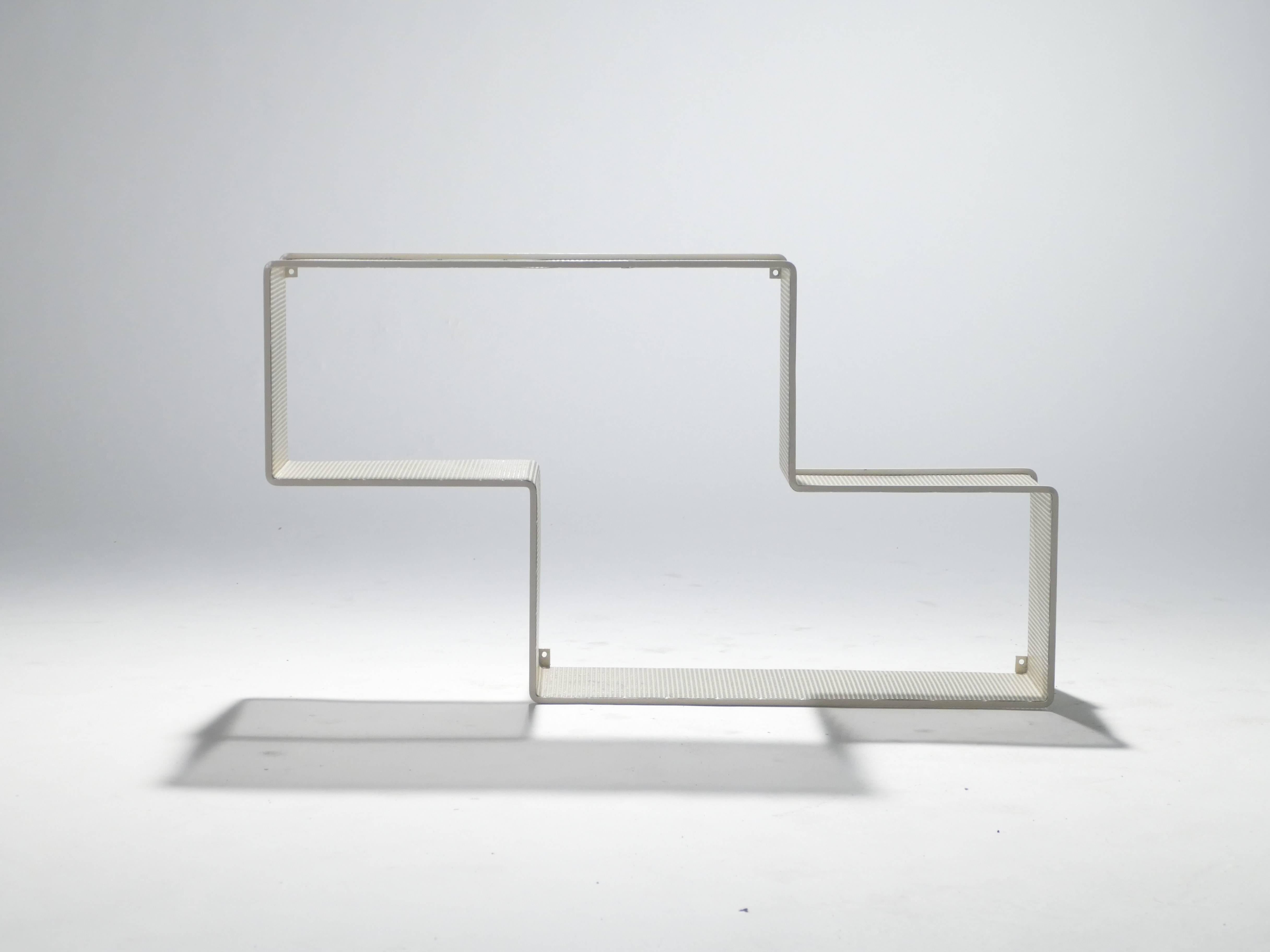 With its strong lines, minimal materials, and amusing design, this wall shelf is iconic of the Hungarian and French designer Mathieu Matégot. The designer strived to create objects of beauty and imagination that were also functional. This particular
