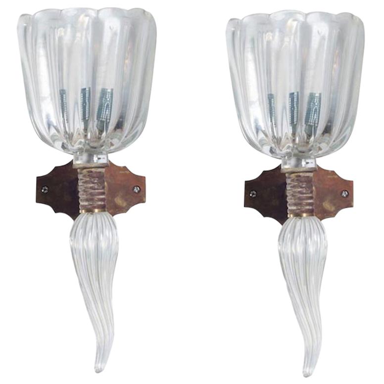 Italian Venetian Sconces in Blown Murano Glass Iridescent color, 1960s
This is a pair of amazing Italian sconces, attributed to Seguso and dated 1960s, composed by an elegant glass cup, decorated at the bottom by a glass flame, both of them in
