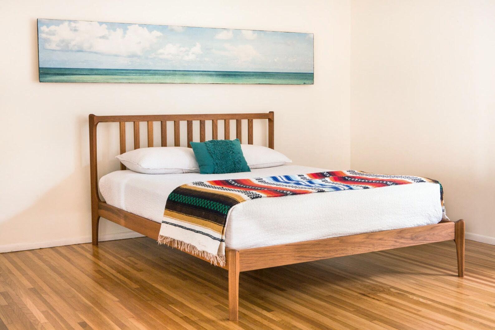 This King bed is a new take on the flagship Deeble bed design. All basic details, such as joinery, assembly, dimensions etc. are the same as the classic modern bed but this version features a slatted headboard. The slats run down to the head rail,