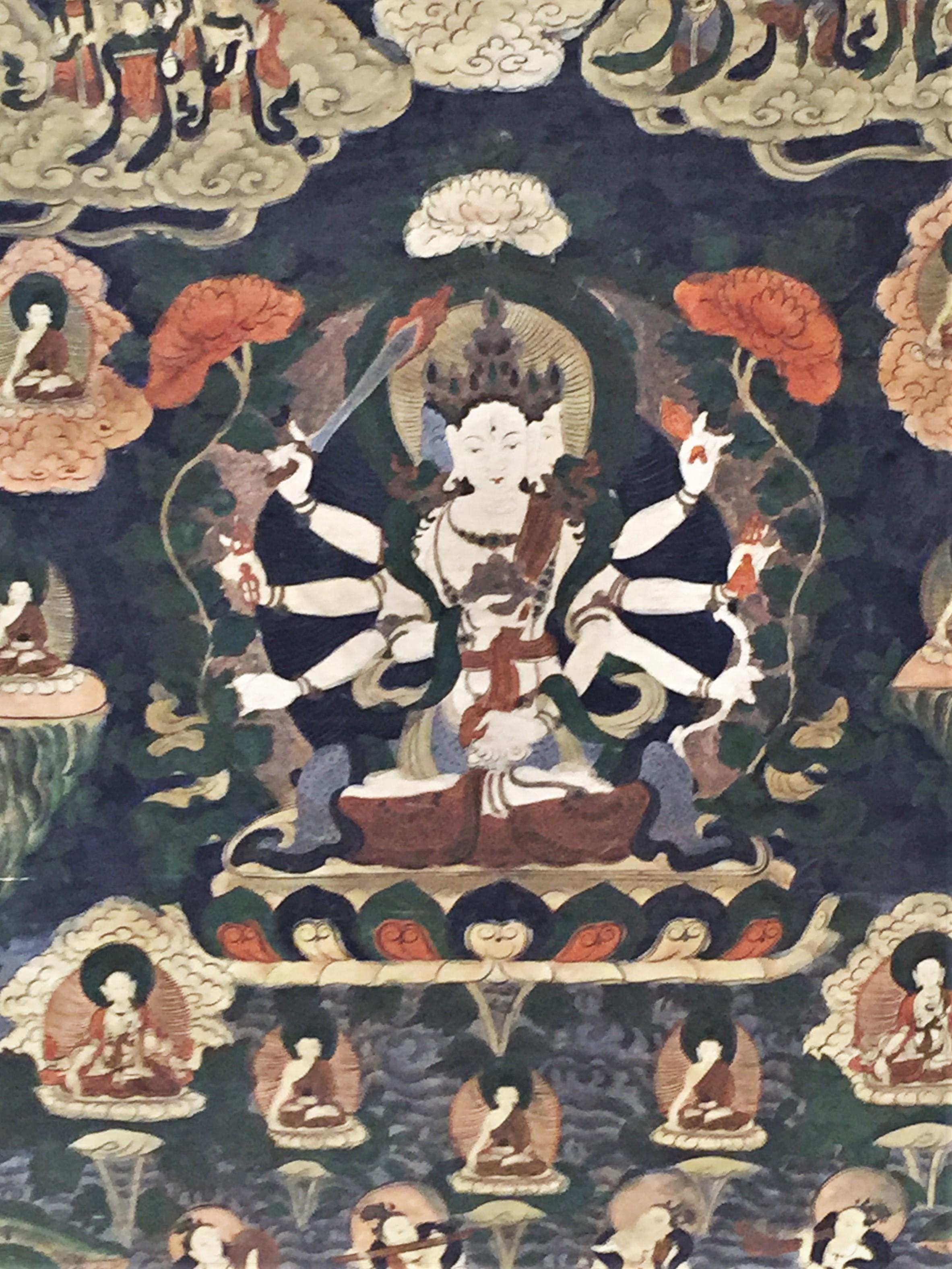 Rare! Unusually large for this type of Buddhist religious thangka art paintings, this 19th century work of art, depicting deeds of the most important Tibetan Buddhism deity, in all likelihood, served as a textbook in one of the Tibetan monasteries.
