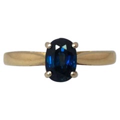 Deep Blue 1.25 Carat Sapphire Solitaire 18 Karat Mixed Gold Solitaire Ring