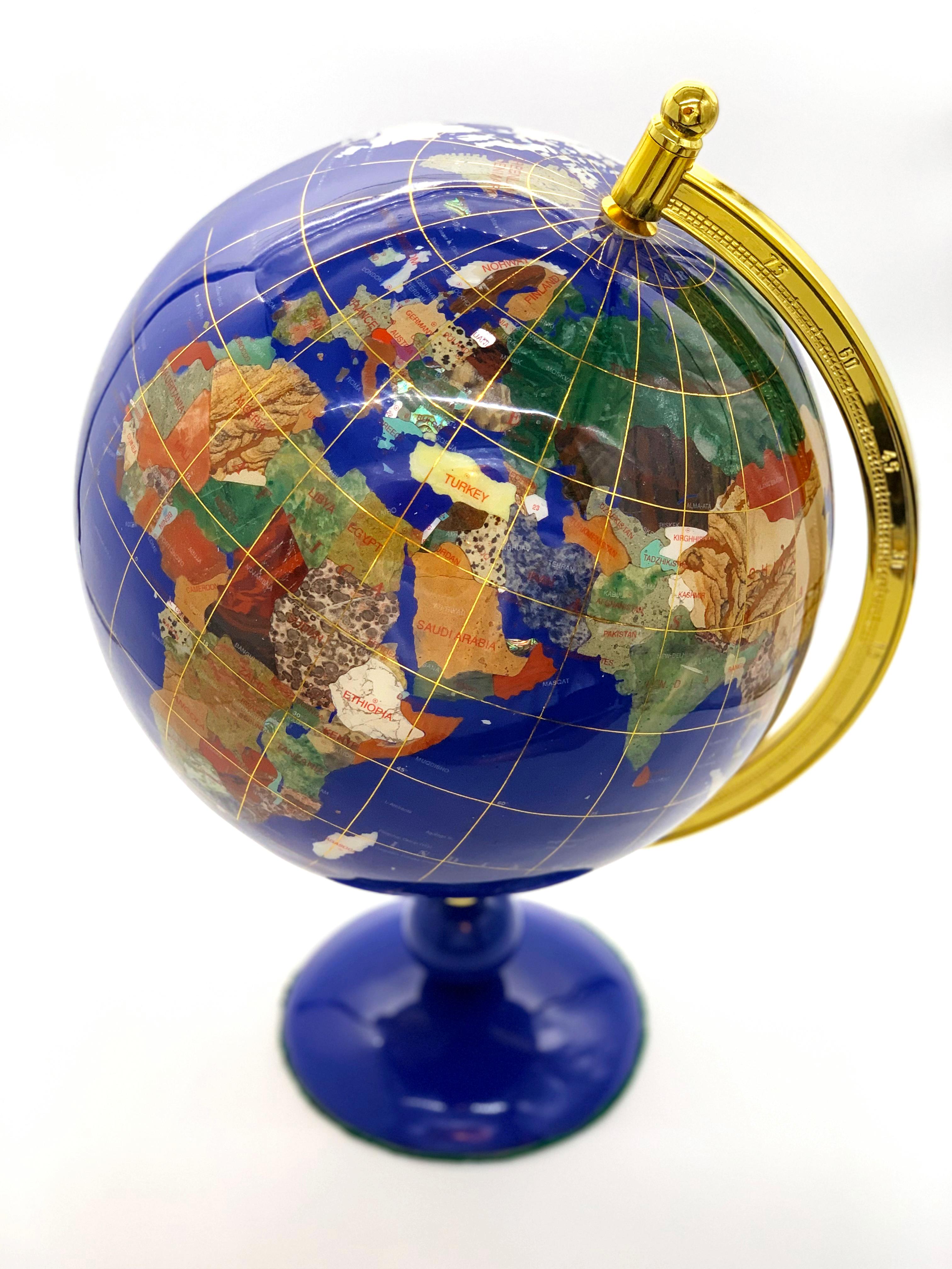 This beautiful globe has been handmade from high quality gemstones, semiprecious stones and shells.
Incredible detail - individual gemstone or shell for each country and then the globe has been coated with resin for protection.
The globe can