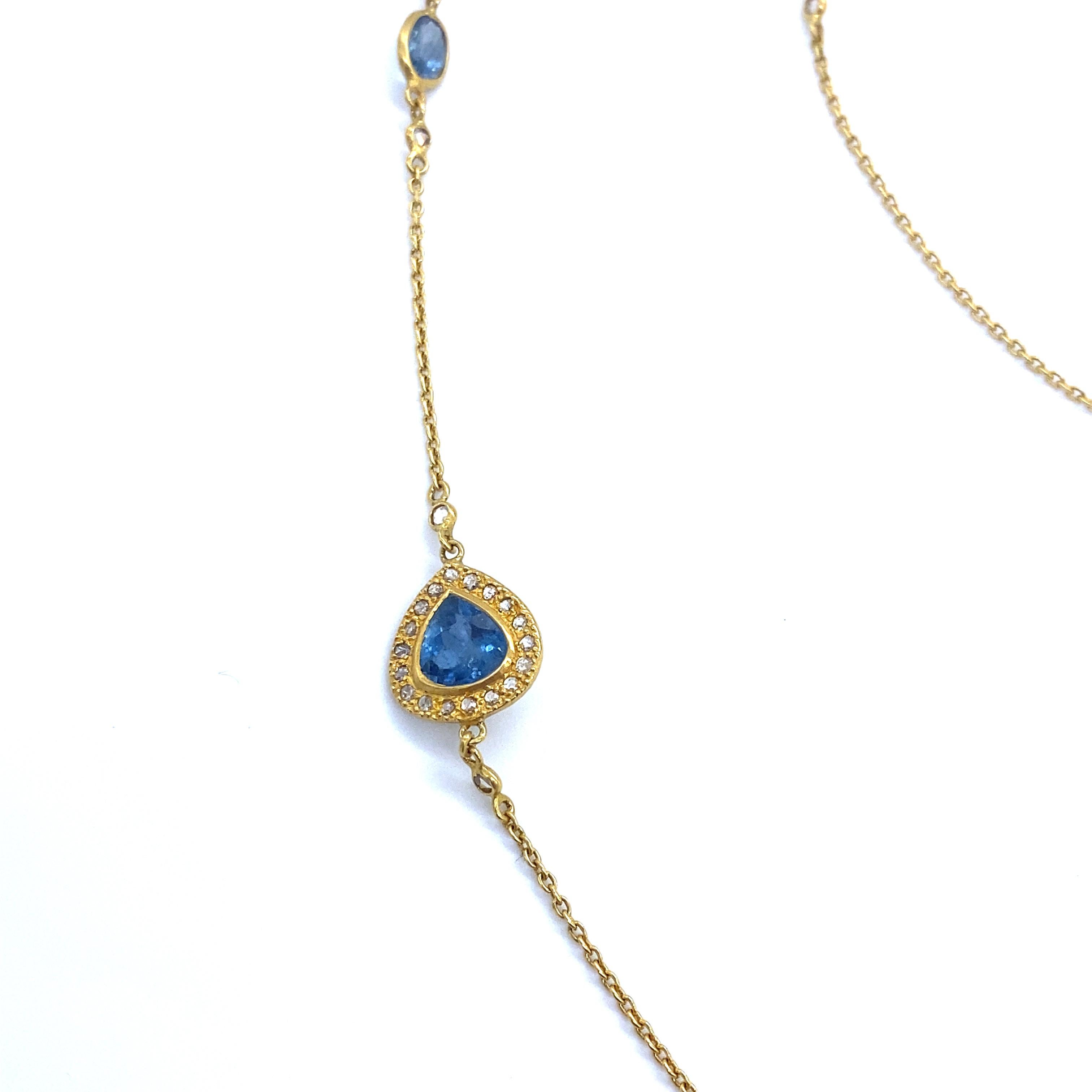 Affinity Aquamarine and Diamond Necklace Set In 20 Karat Yellow Gold With 12.70 Carat Aquamarine and 1.08 Carat Diamonds. The Necklace Is Finely Crafted With Aquamarine On A Yellow Gold Chain. The Necklace Is 36 Inches Long.