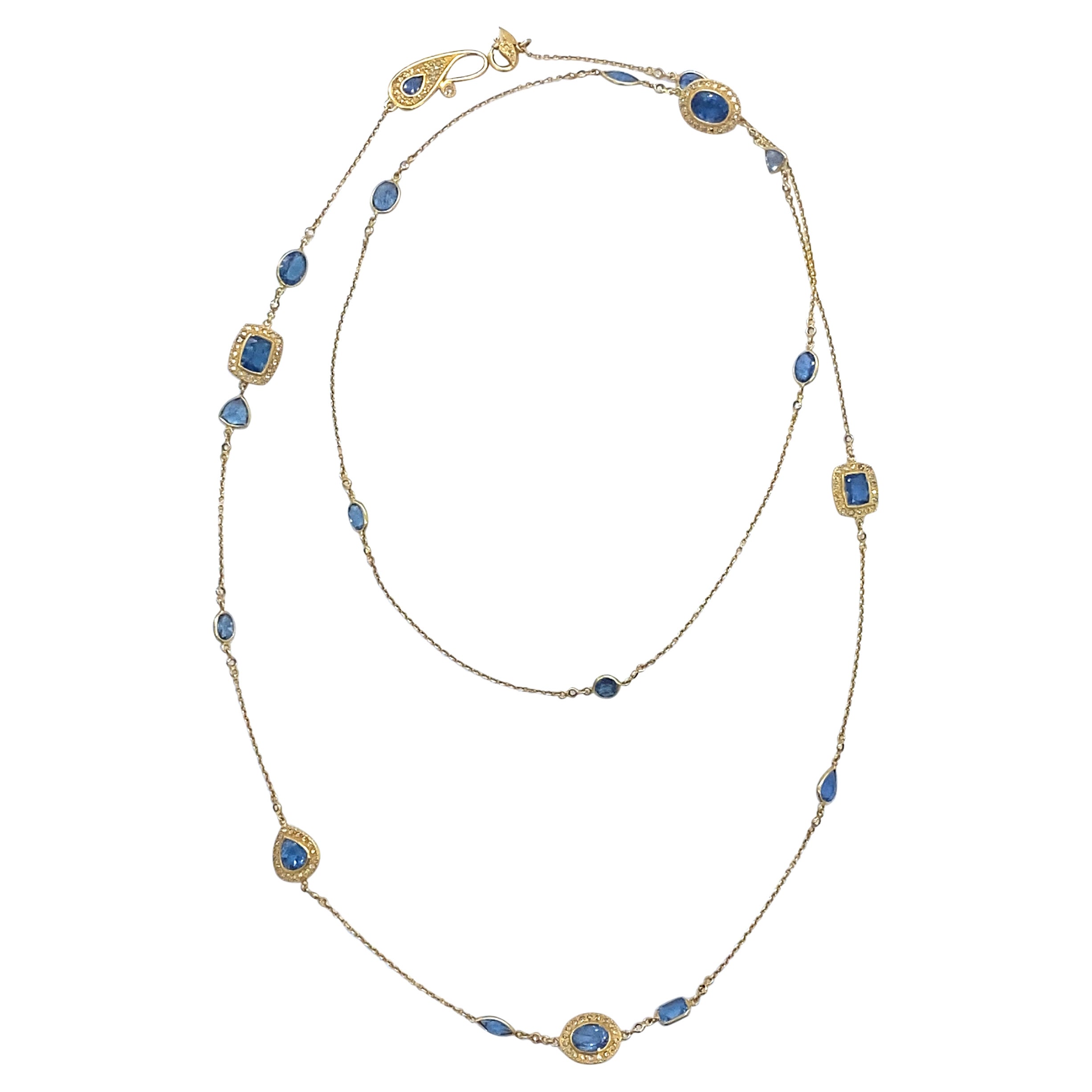Collana di diamanti e acquamarina blu profondo in oro giallo 20 carati