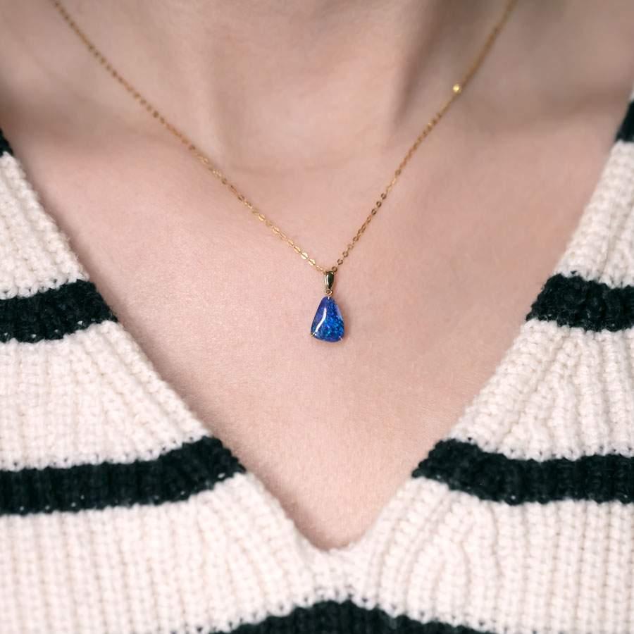 Arts and Crafts Deep Blue Australian Black Opal Pendant Necklace 18K Yellow Gold For Sale