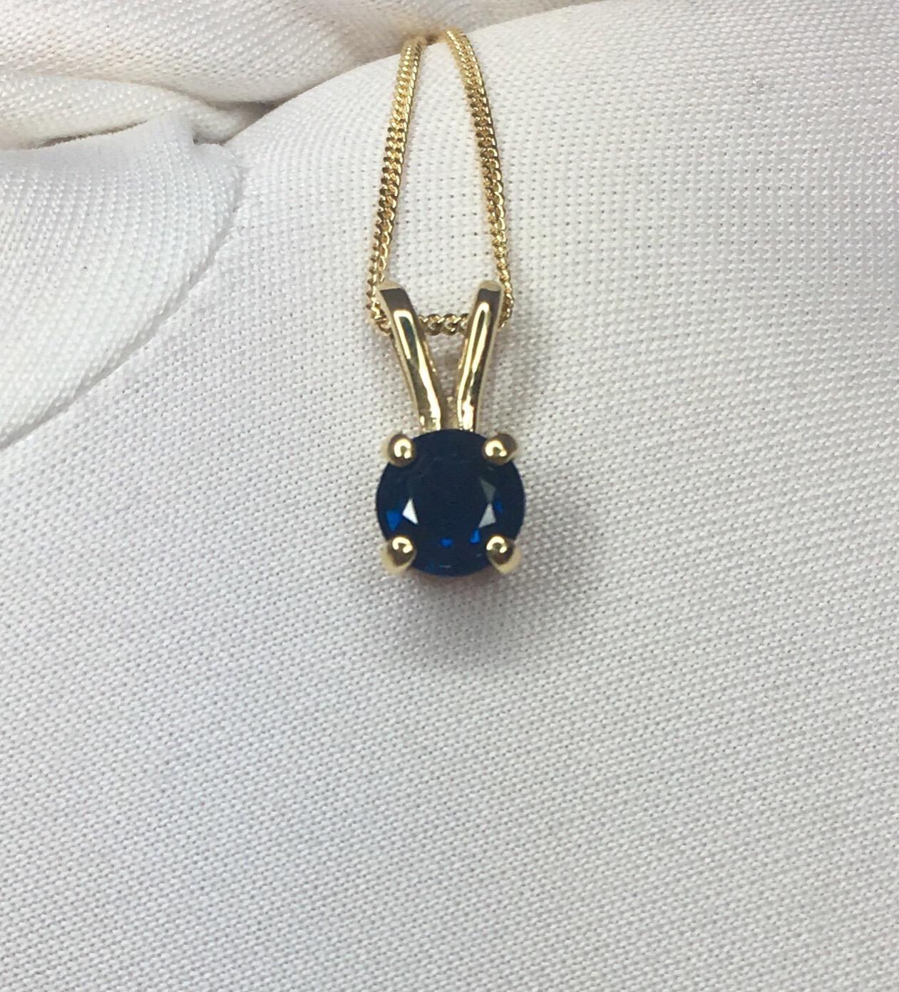 Natural deep blue sapphire pendant.
Beautiful round cut Sapphire. Set in a fine, highly polished 18k yellow gold pendant.

0.57 carat stone with a stunning deep blue colour and good clarity. Some inclusions visible when looking closely but still a