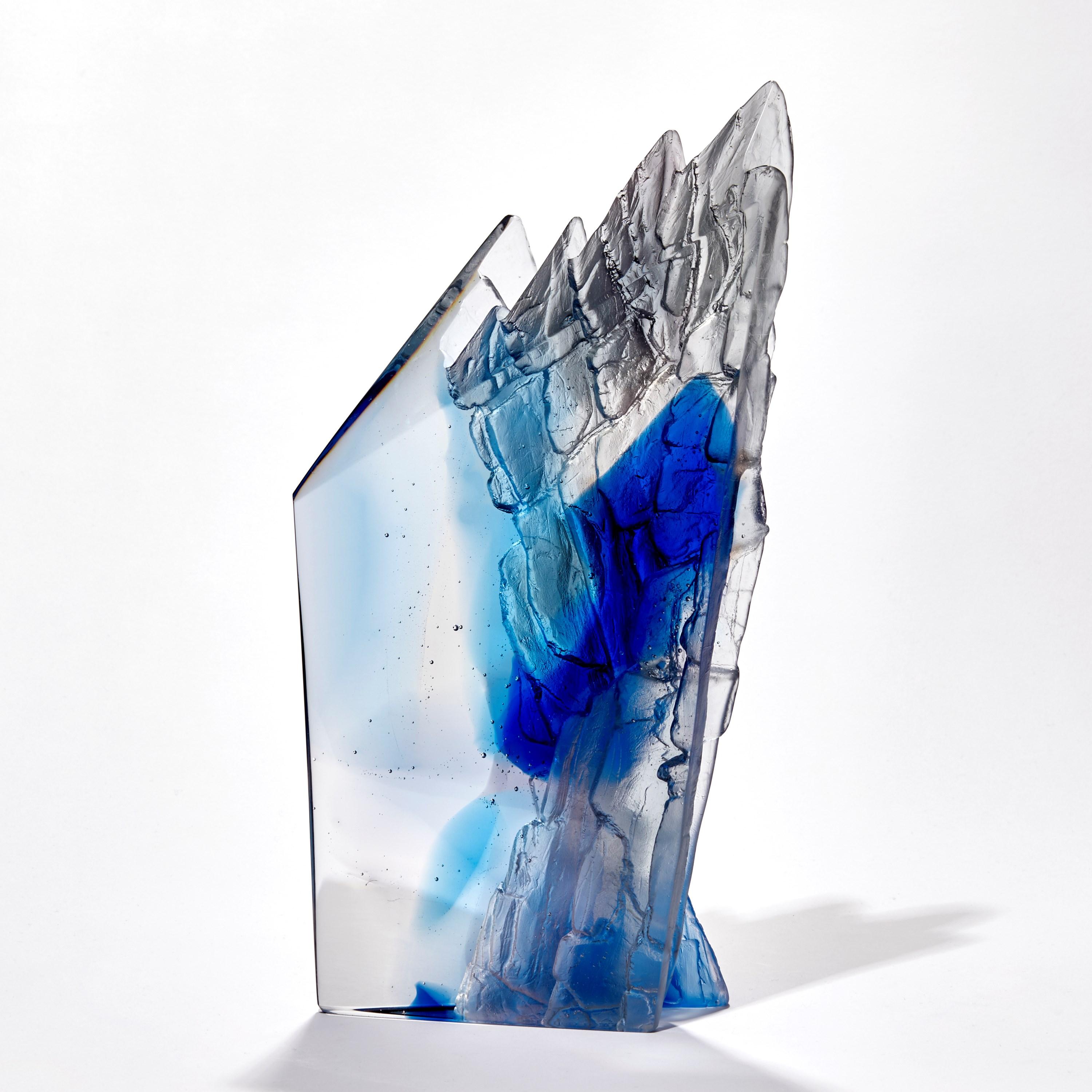 'Deep blue cliff' is a unique cast glass sculpture by the British artist, Crispian Heath.

Crispian Heath's work is predominantly inspired by landscape and his love for exploring the rugged cliffs and other geological sites which are unique to