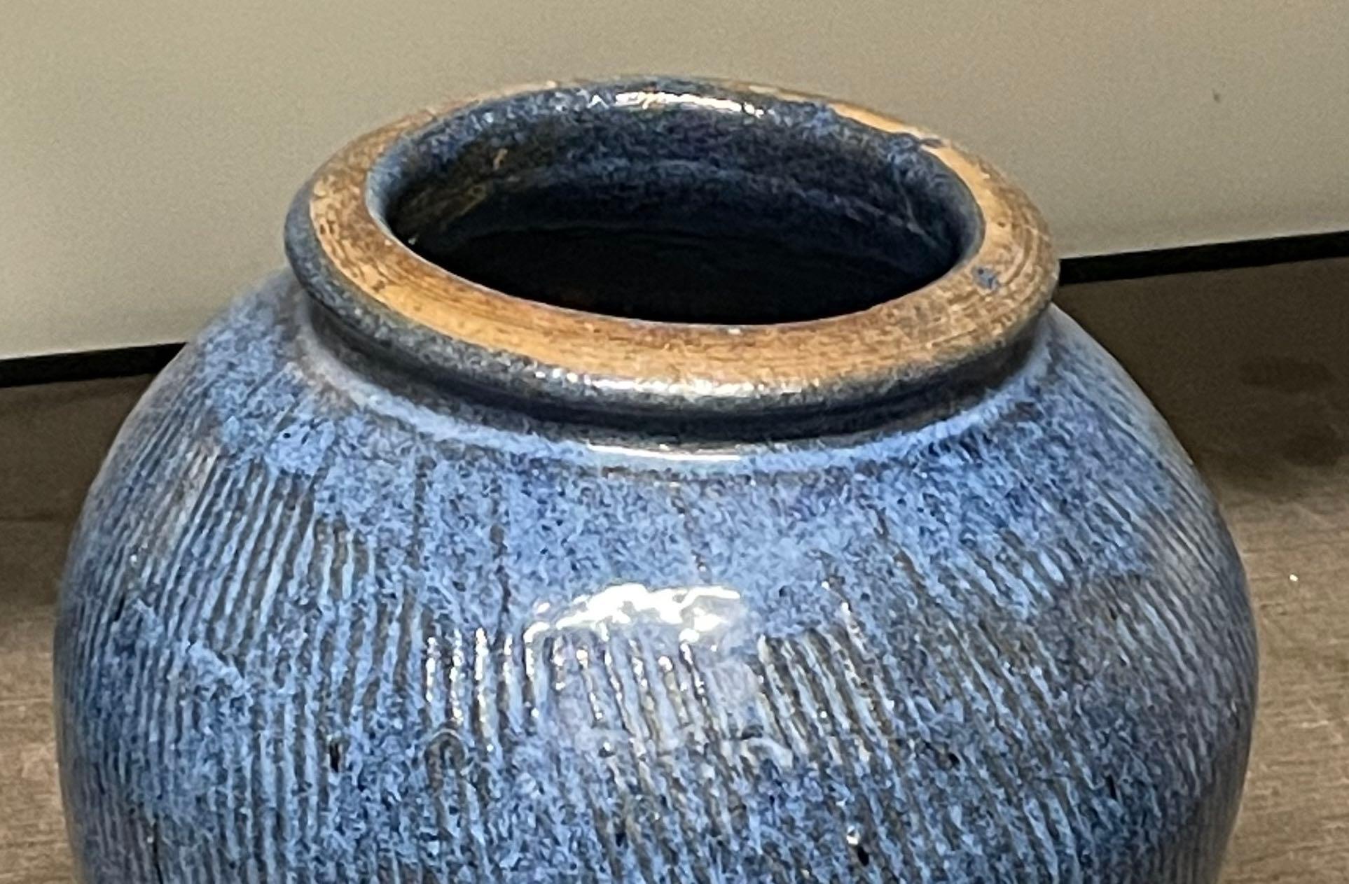 Contemporary Chinese vase with deep blue glaze and vertical stripe detail.
Two available and sold individually.
