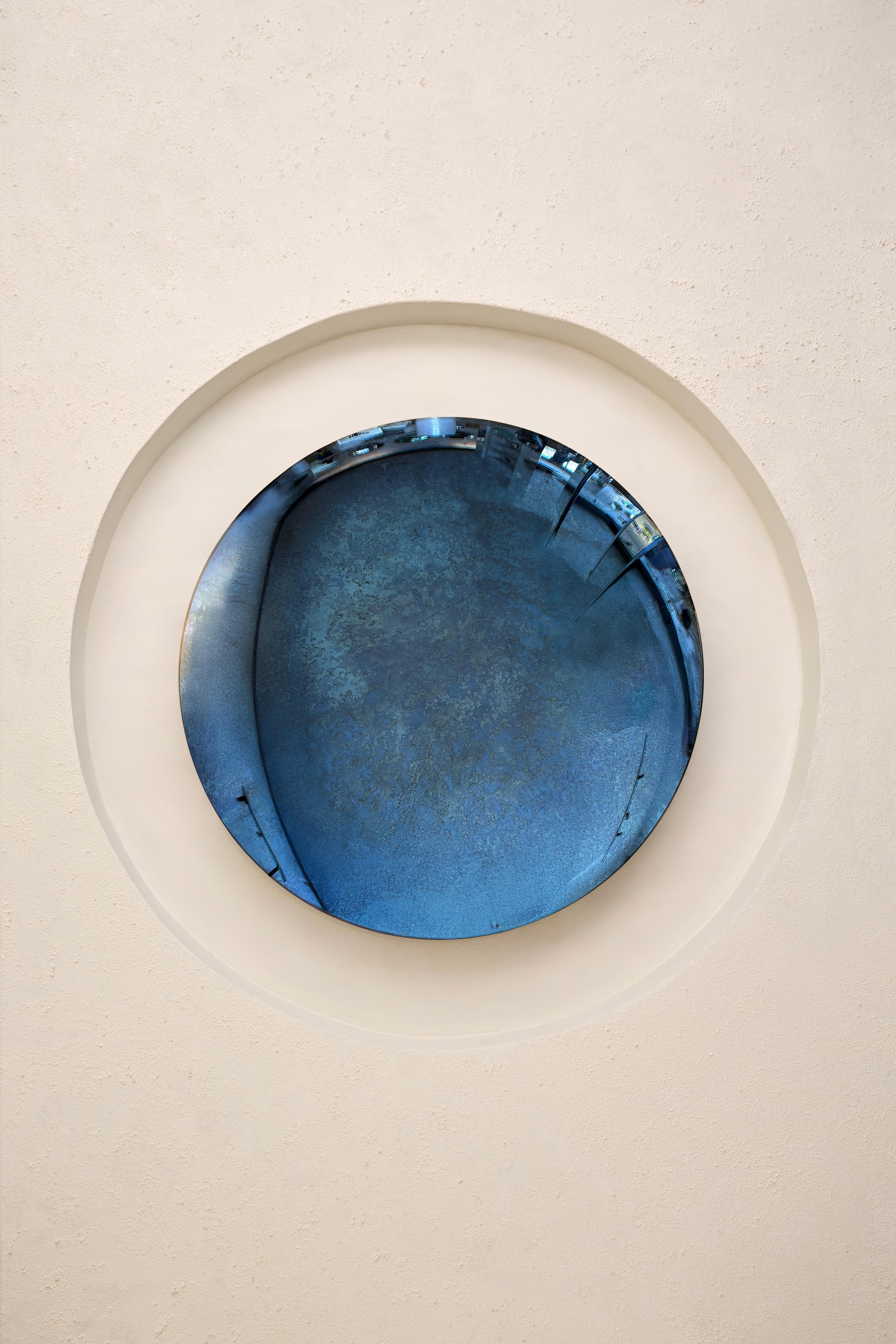 Convex Mixed Technique Mirror.
Ø97 cm  Depth: 8 cm  Thickness: 4 mm 
Colour: Multicolor  Hanger: Brass

HOMA's convex mirrors merges antique mirroring
techniques with modern aesthetics. Through experiments with the chemistry of the mirroring
