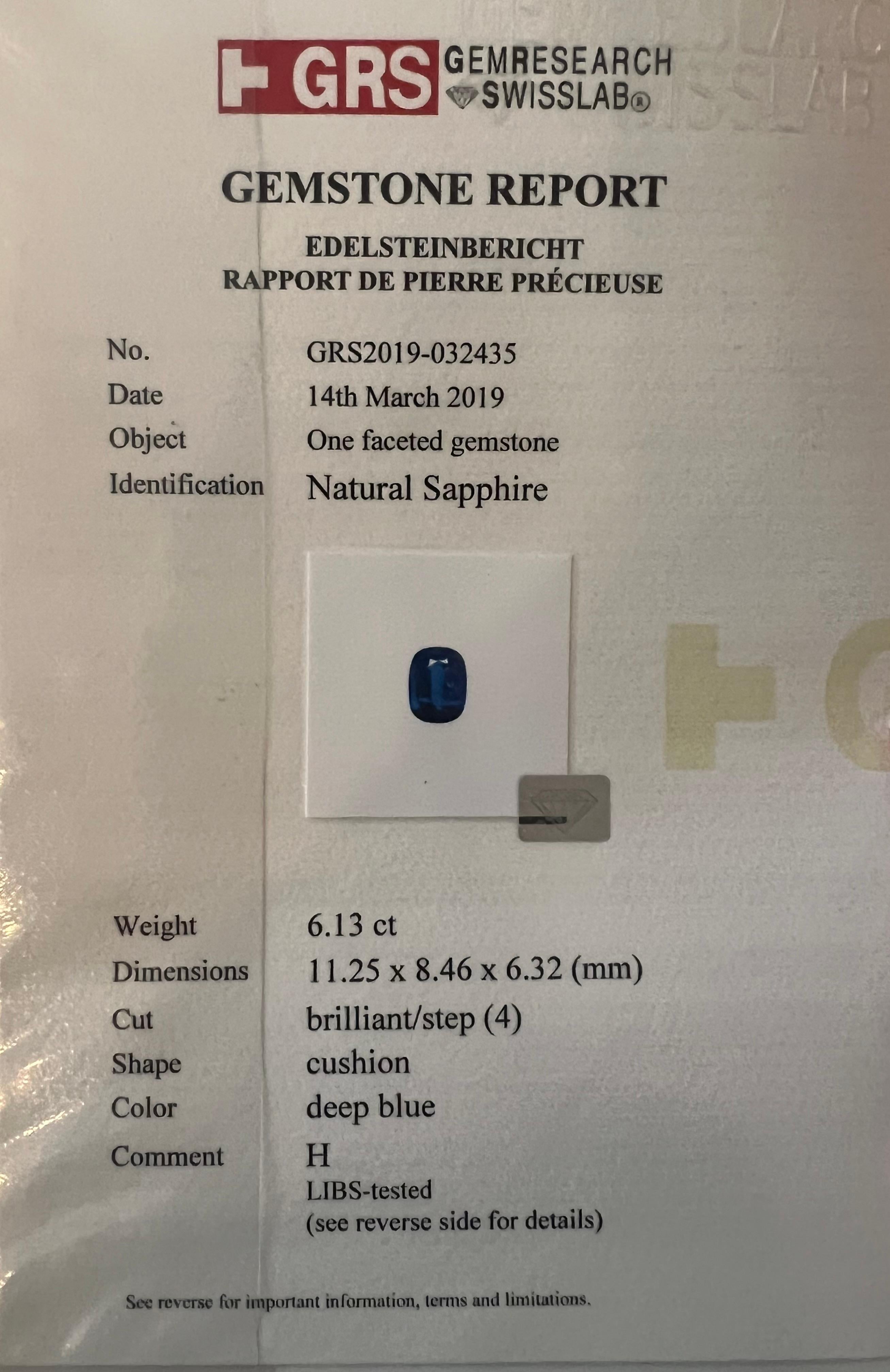 Darker shade (deep blue) sapphire of 6.13 carat with normal heat treatment. With 2 trillion cut diamonds on the shanks and brilliant cut diamond halo. 
The preference for saturation of sapphire is very personal. If you prefer darker shade sapphire,