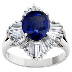 Deep Blue Oval Sapphire Ring with Baguette Diamonds Set in Platinum